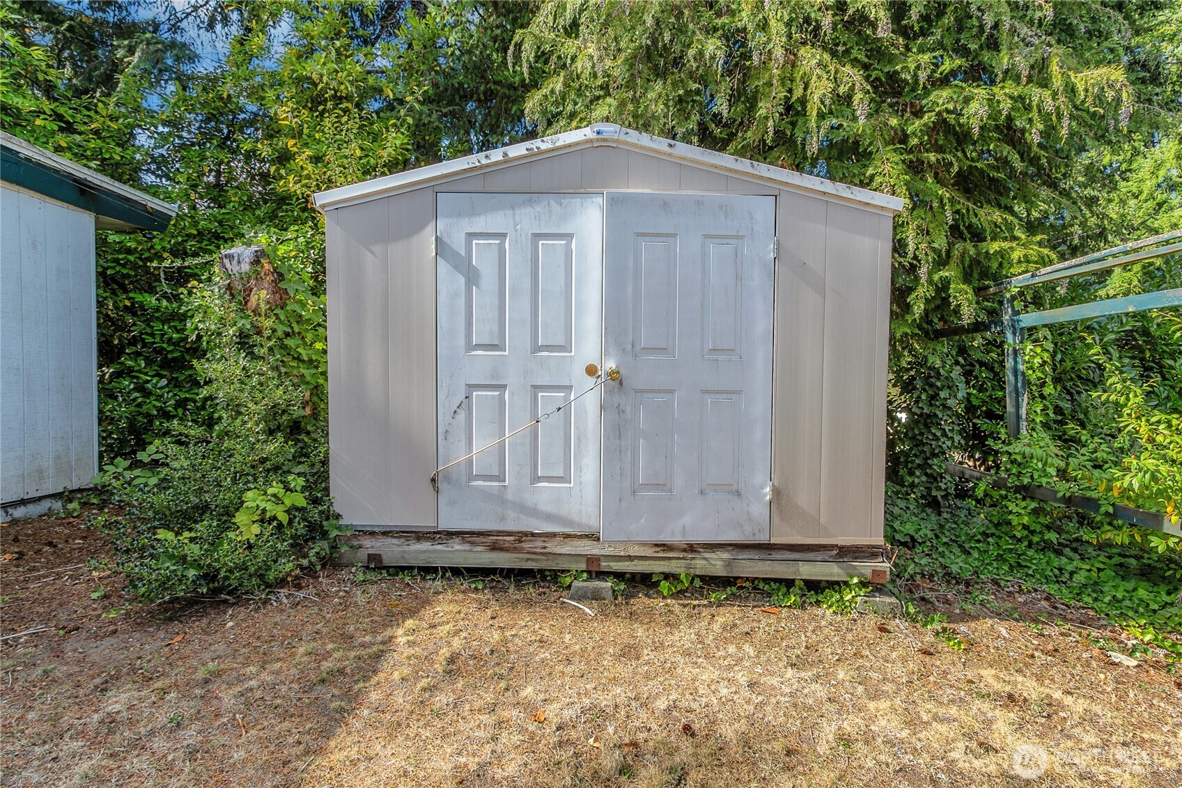 Spare shed for storing garden tools.