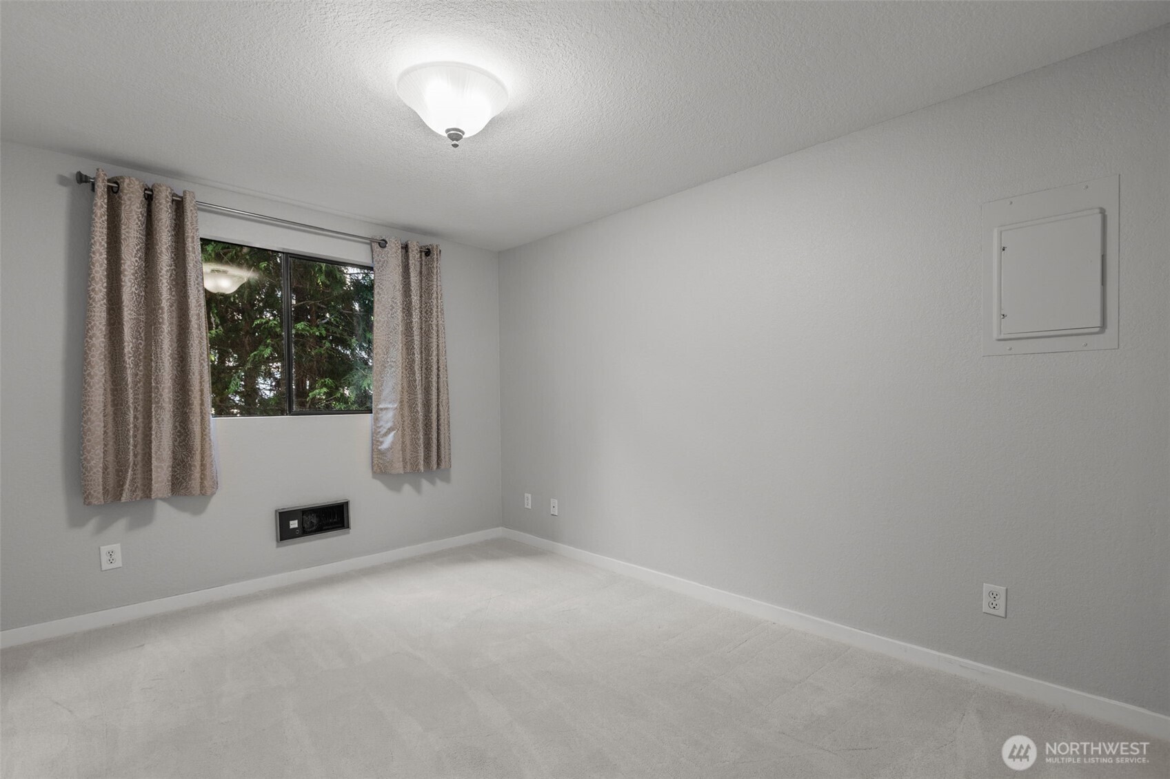 Second bedroom perfect for guests, office, or flexible use