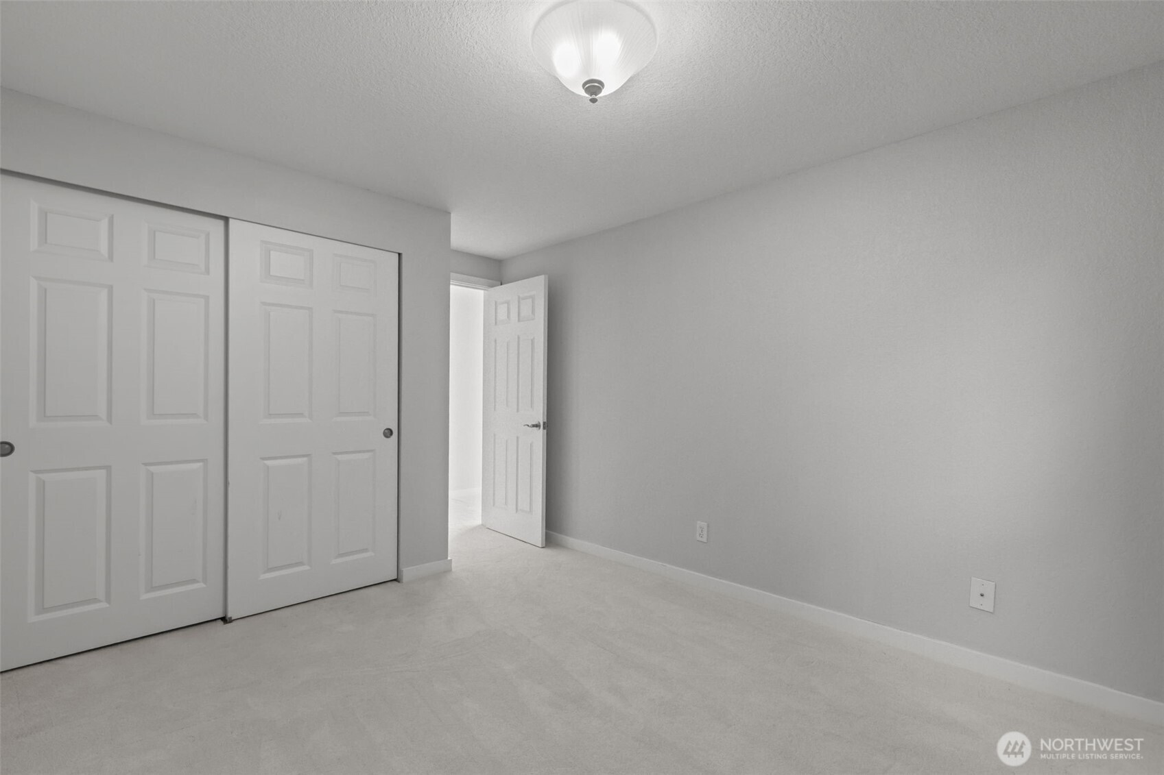 Second bedroom perfect for guests, office, or flexible use