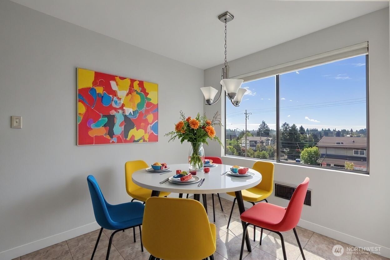 Bright open living room with cozy wood-burning fireplace and large windows