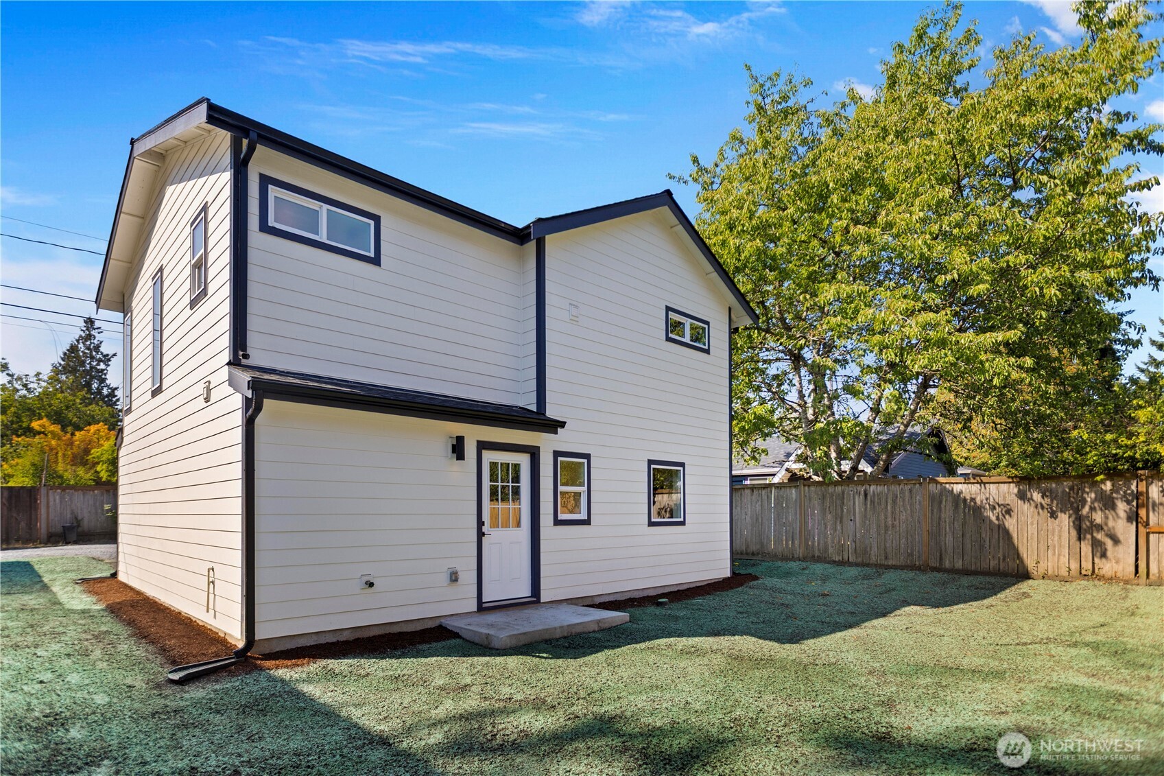 Backyard with newly hydroseeded grass w/ fenced yard.