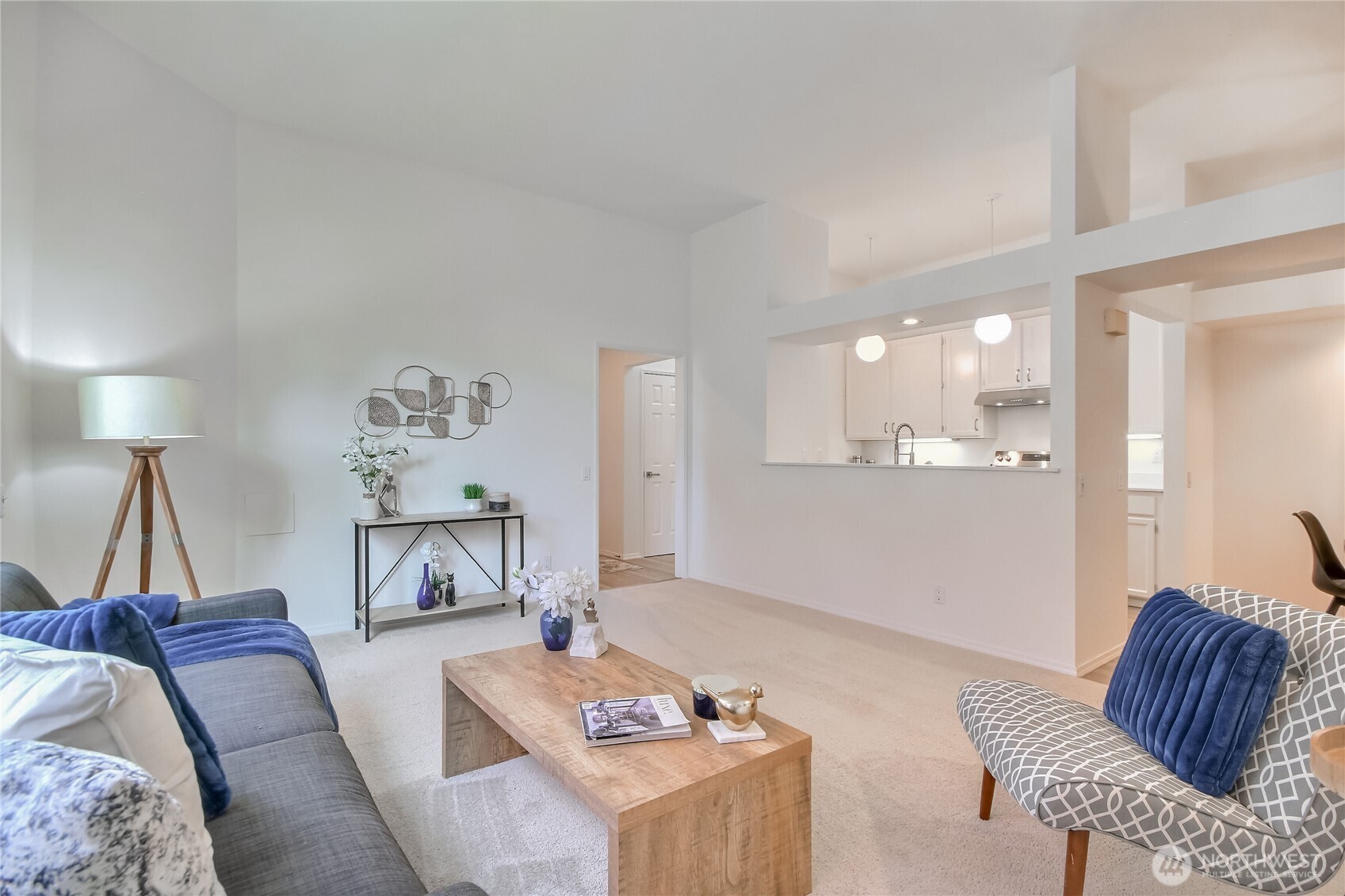 Living room with high ceilings, Vinyl windows, fresh paint and carpet.
