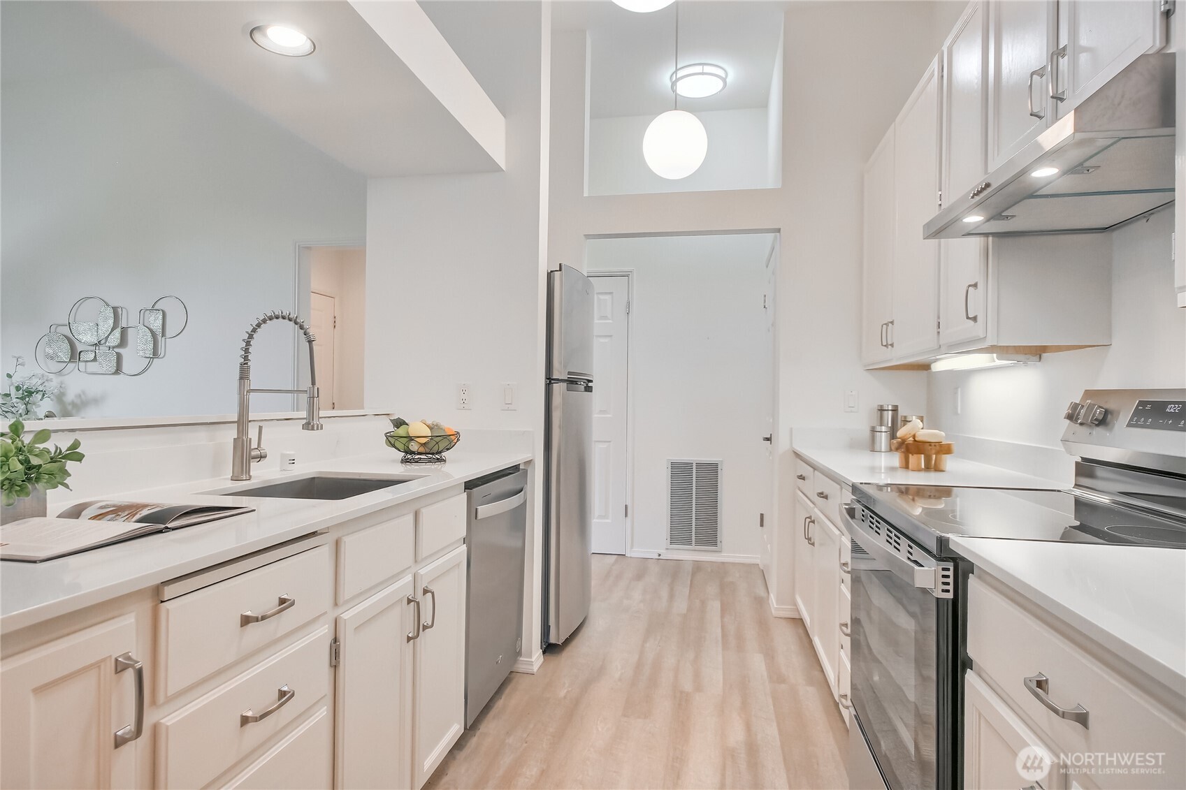 Updated kitchen with new hardware, appliances and countertops.
