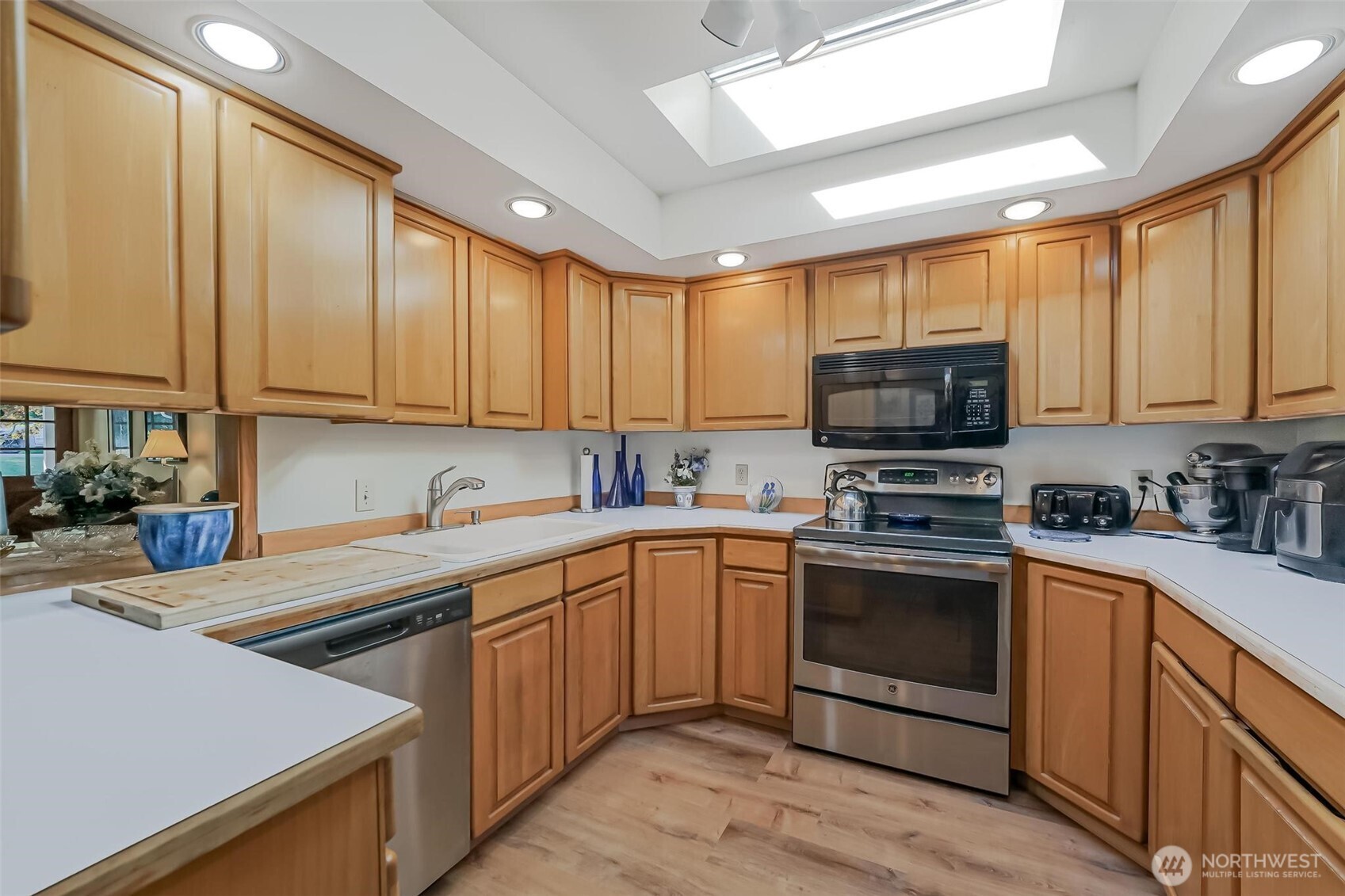 Kitchen includes plenty of cabinetry & storage.
