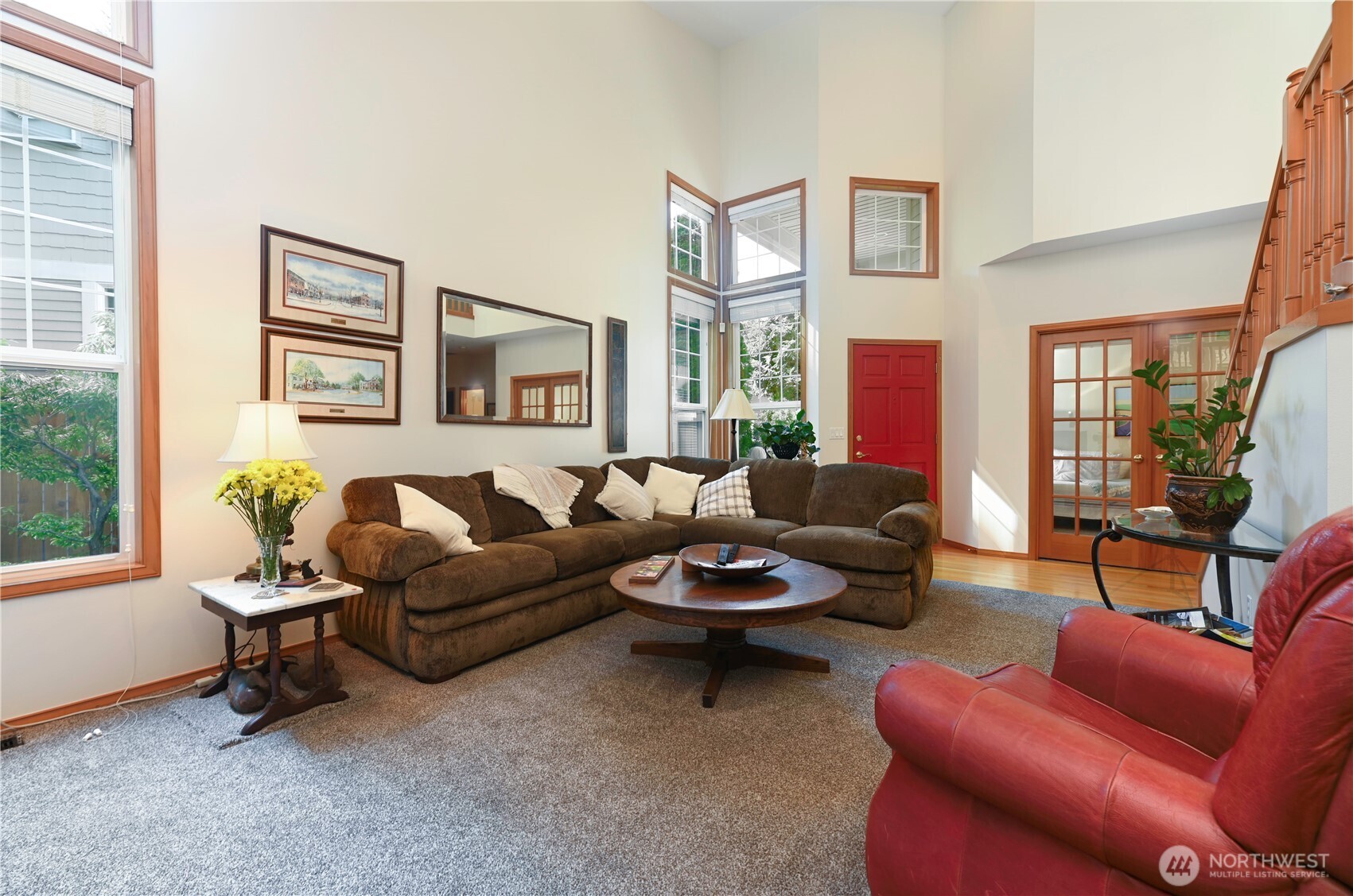 Living room is open and filled with natural light. Lives private.