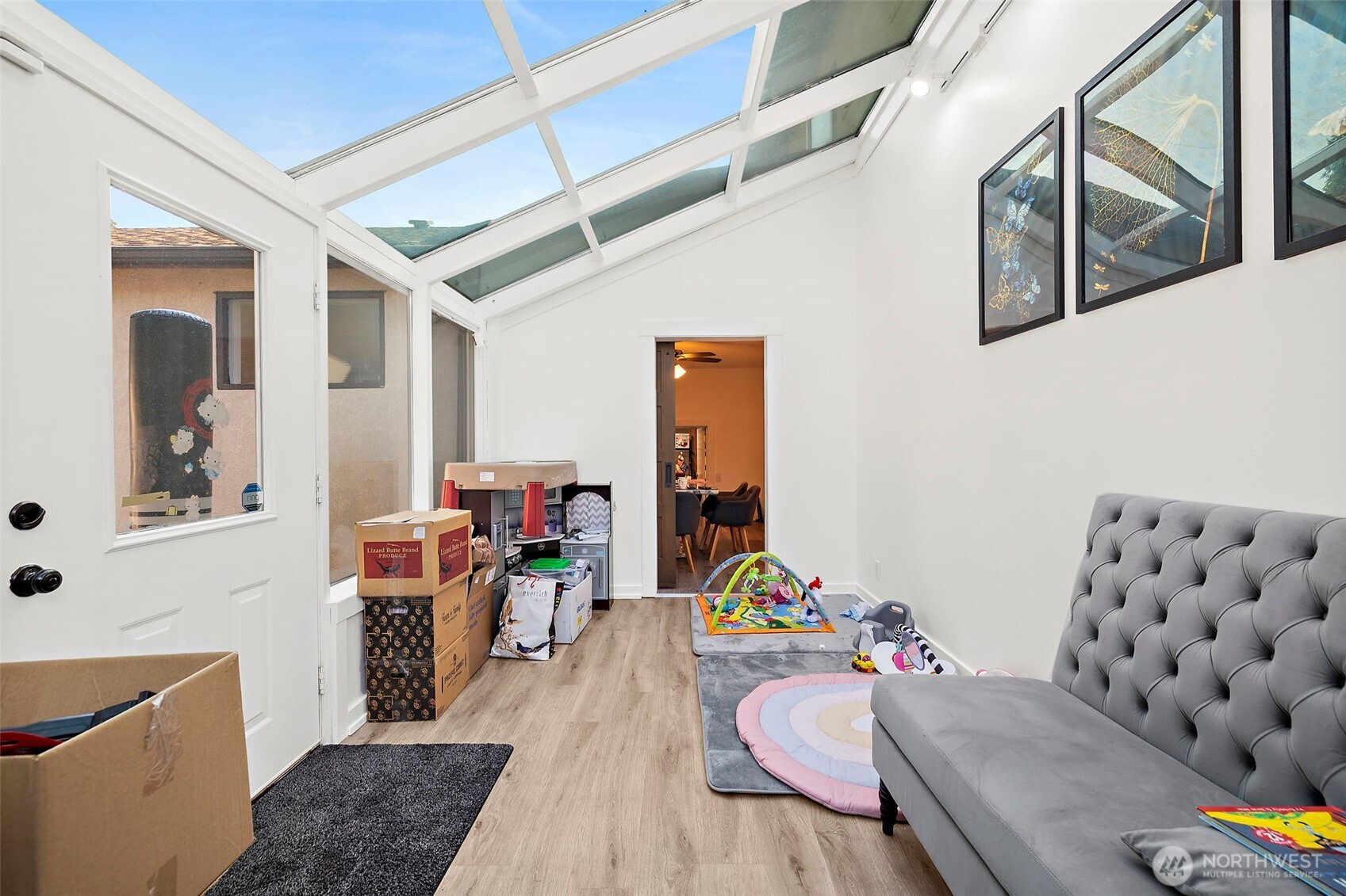 Sunroom with access to the backyard patio.