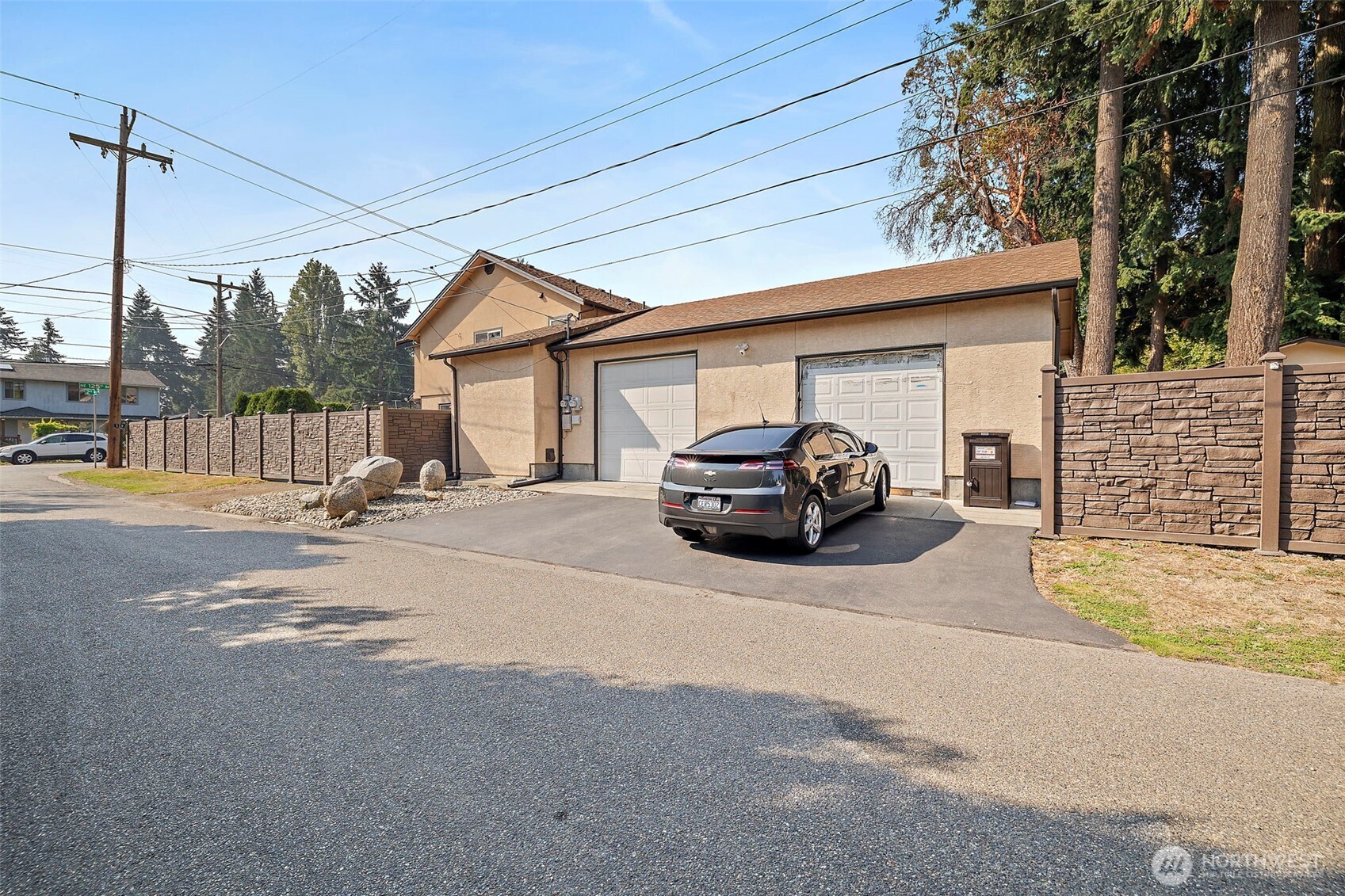Side view of the home with EV charging.