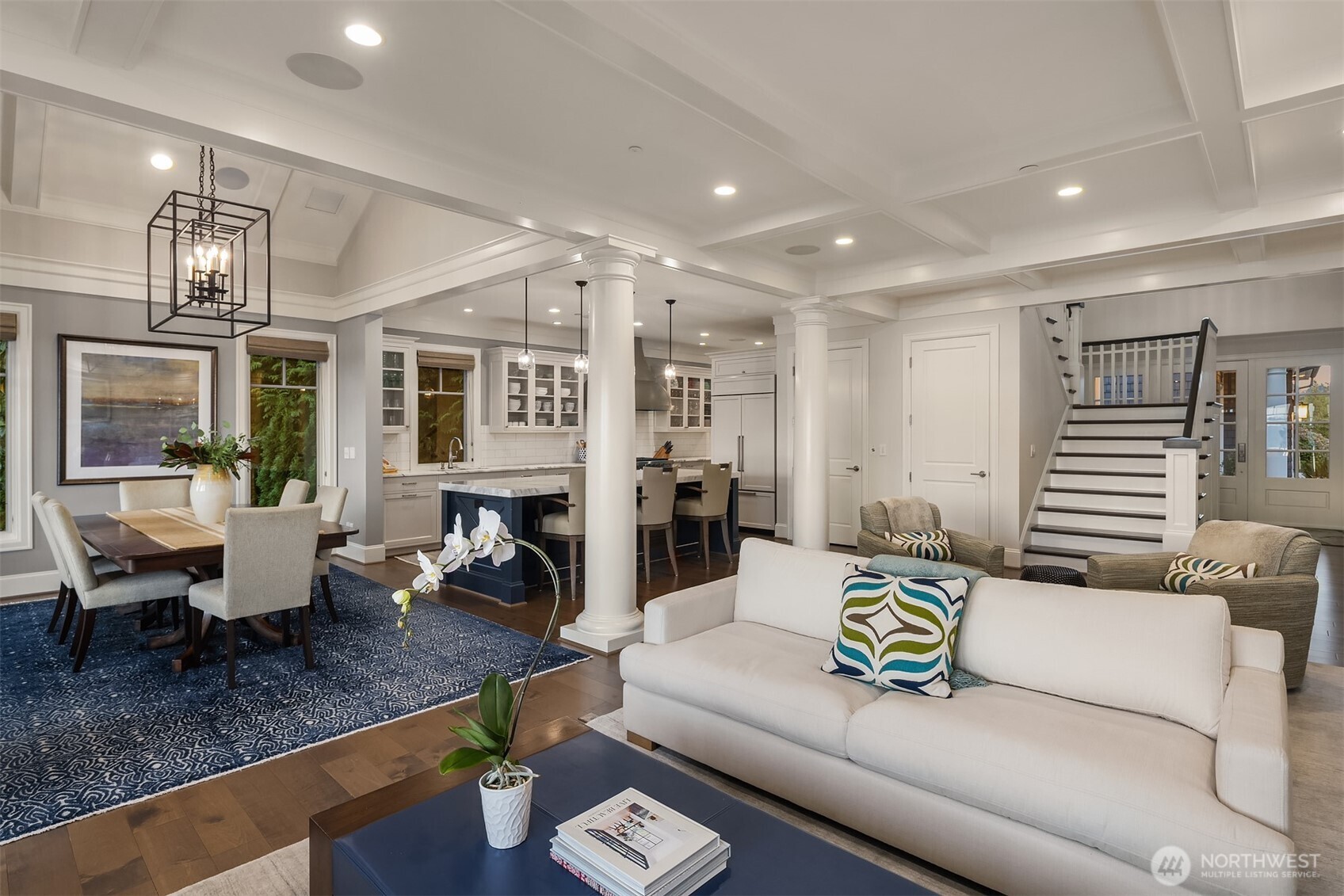 The great room is full of beautiful custom details and is the heart of this wonderful waterfront home.