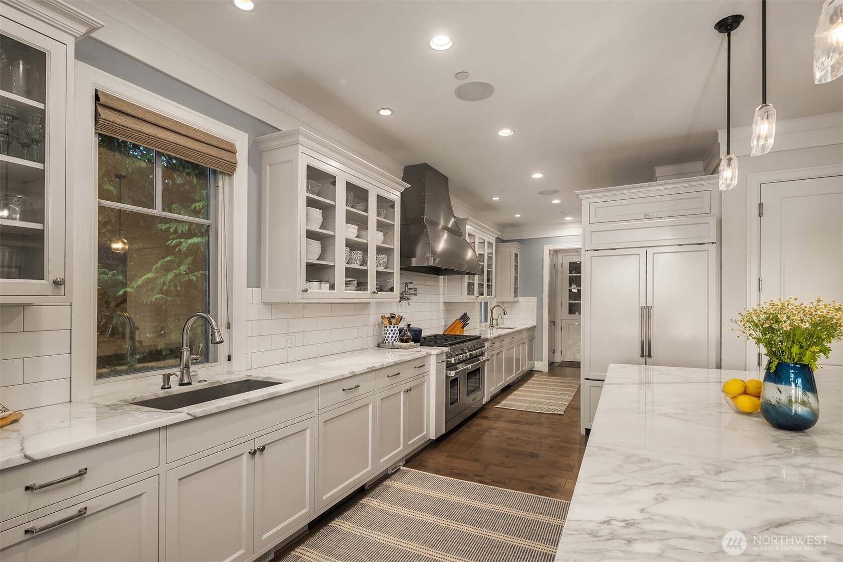 This dreamy kitchen was designed by a serious entertainer /chef and it shows!  The flow and professional appliances is ideal and so great for dinner for 2 or 20!
