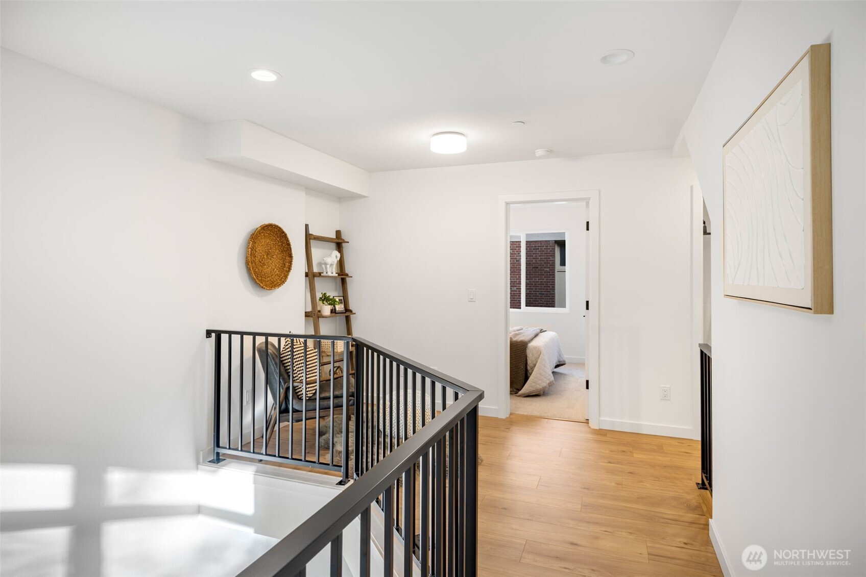 Third level bedroom has ample room for queen size bed and more!  Photo is of model home of same floorplan. Color schemes of finishes may vary.