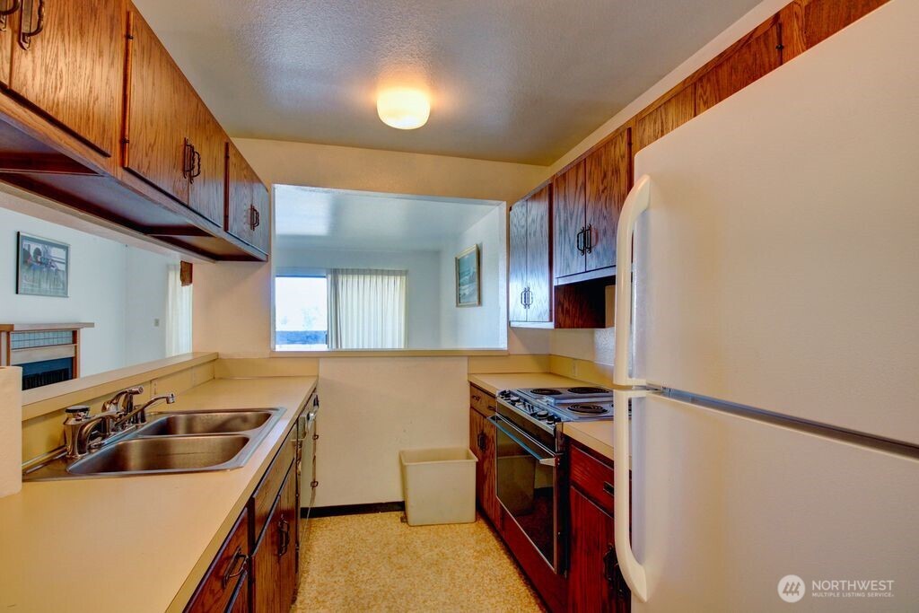 Kitchen looking towards hallway and across to the utility room.