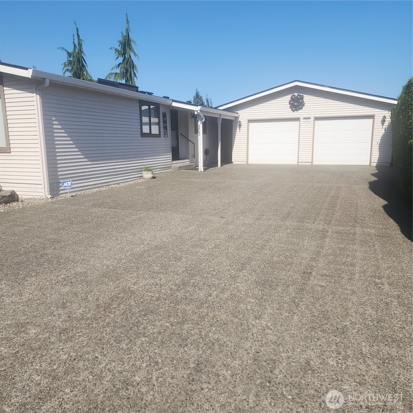 Huge concrete driveway and oversized 2 car garage.