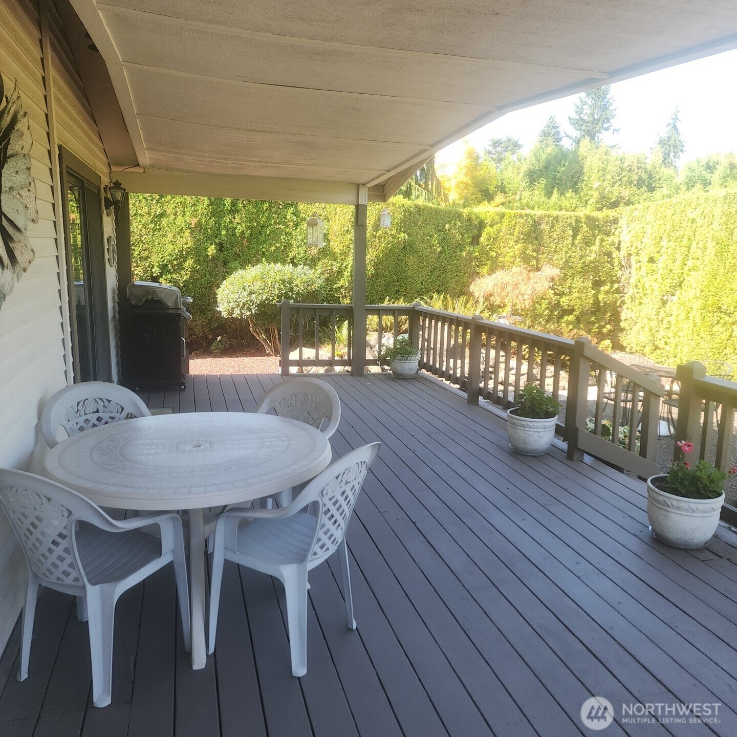 One of many highlights is the covered back deck opening to private back patio and gardens.