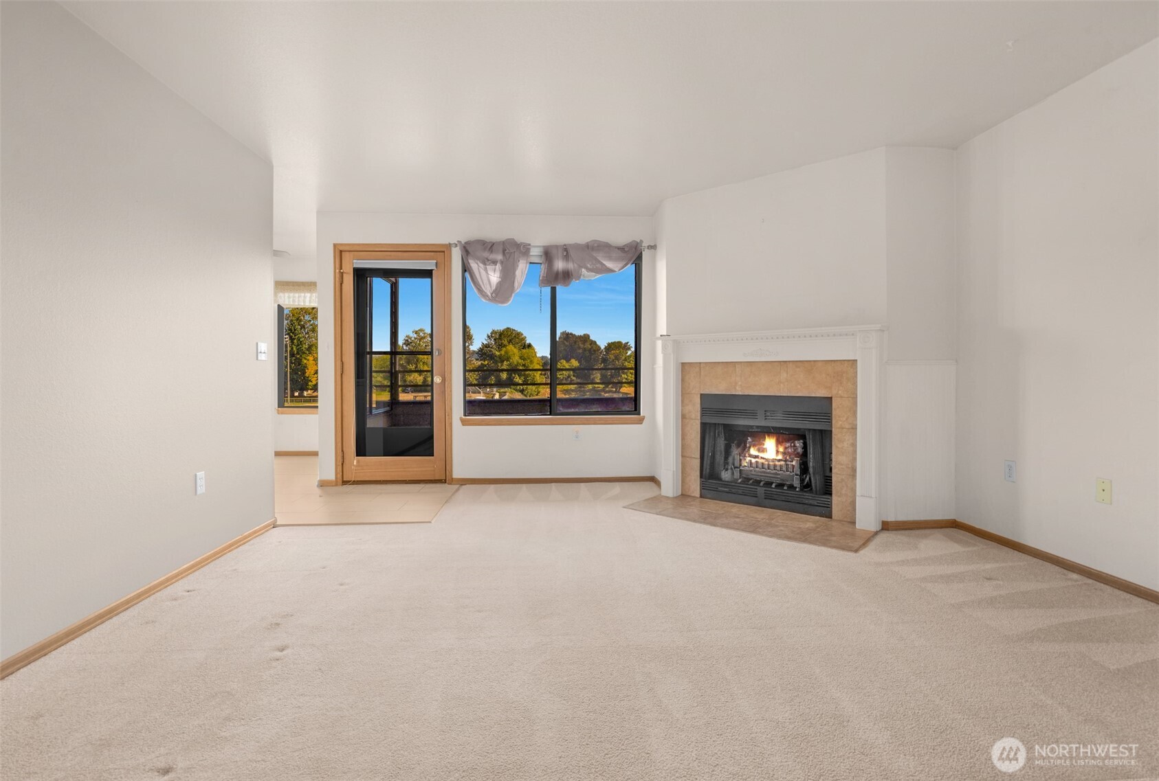 Living room off the kitchen & dining areas.