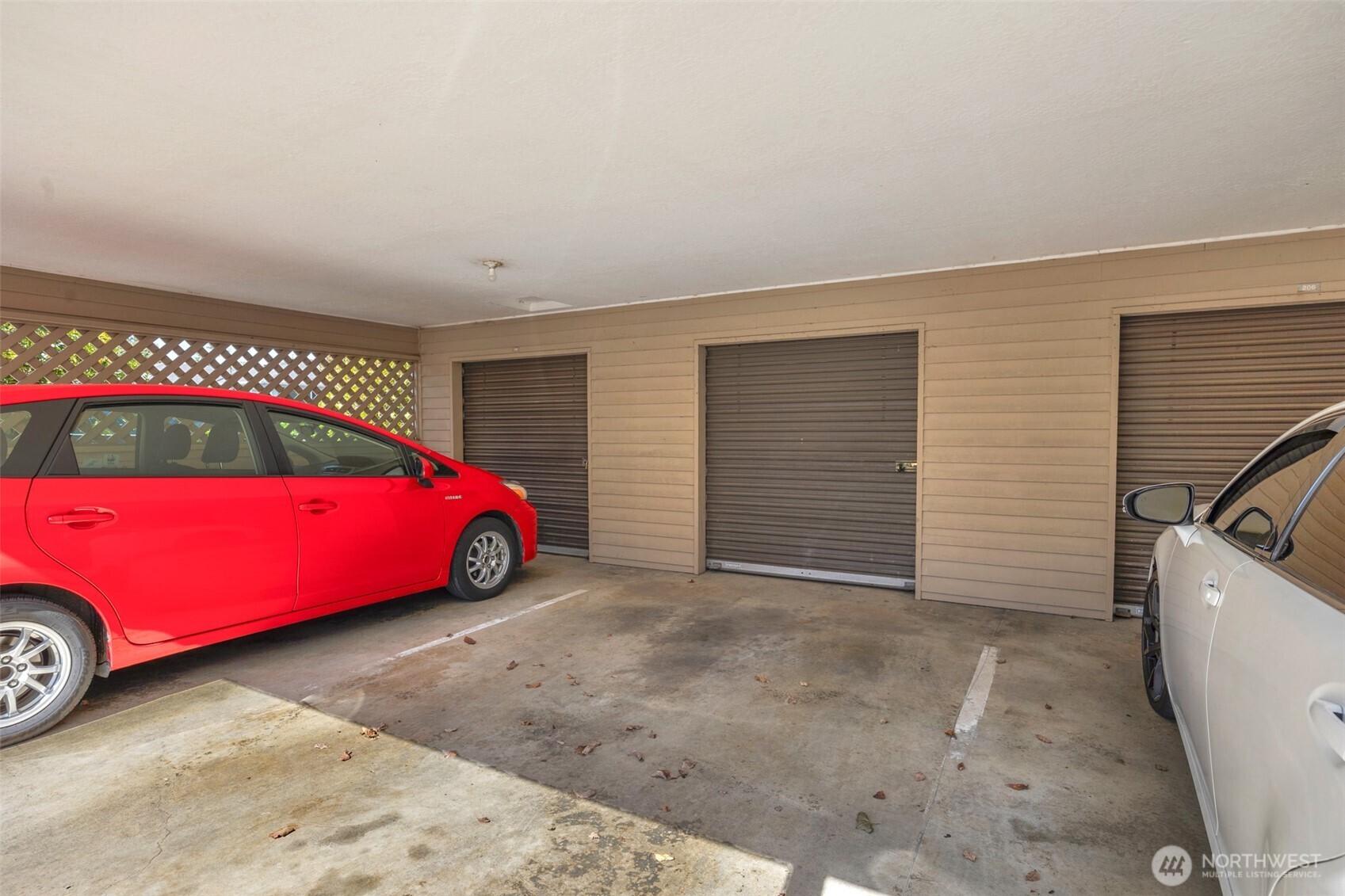 Dedicated parking space with storage closet.