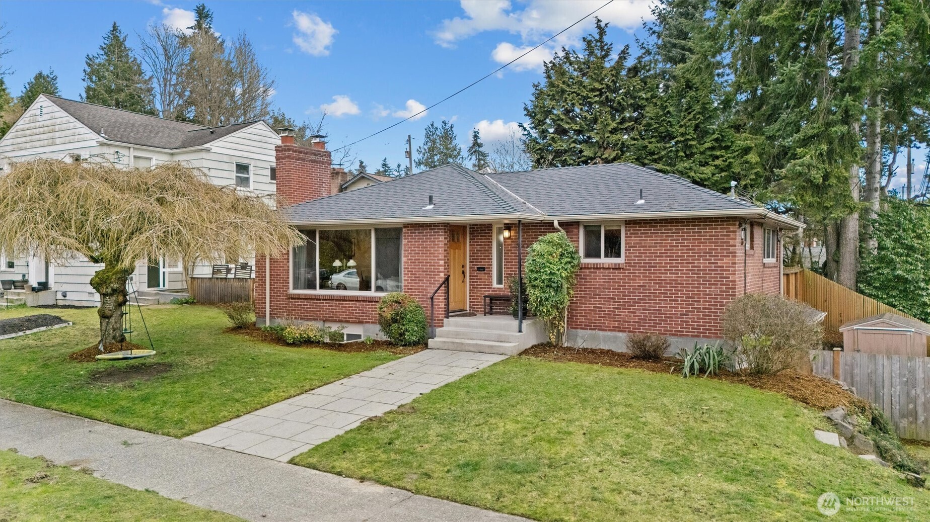 Charming mid-century home set back from street for privacy. Total ease in landscaping and in home maintenance, including new roof.