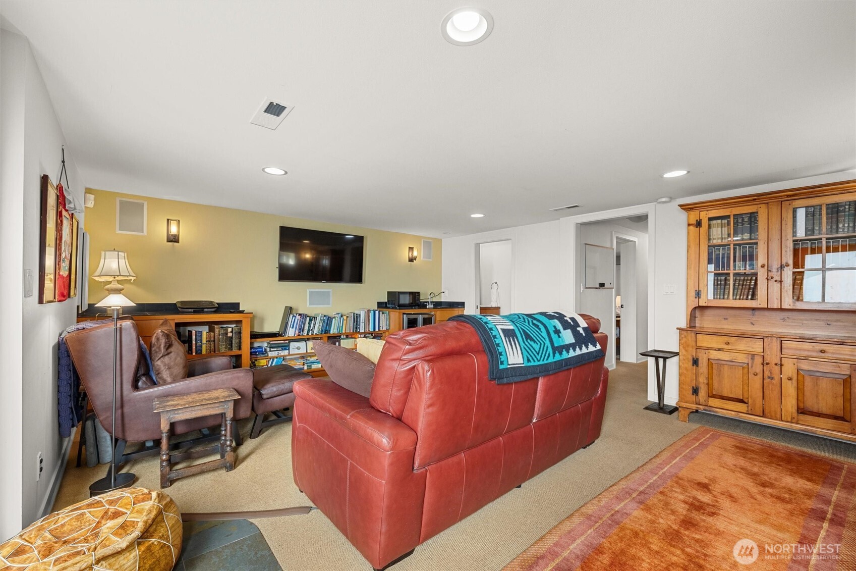 Another view of the large media room. Recessed lighting, surround sound.