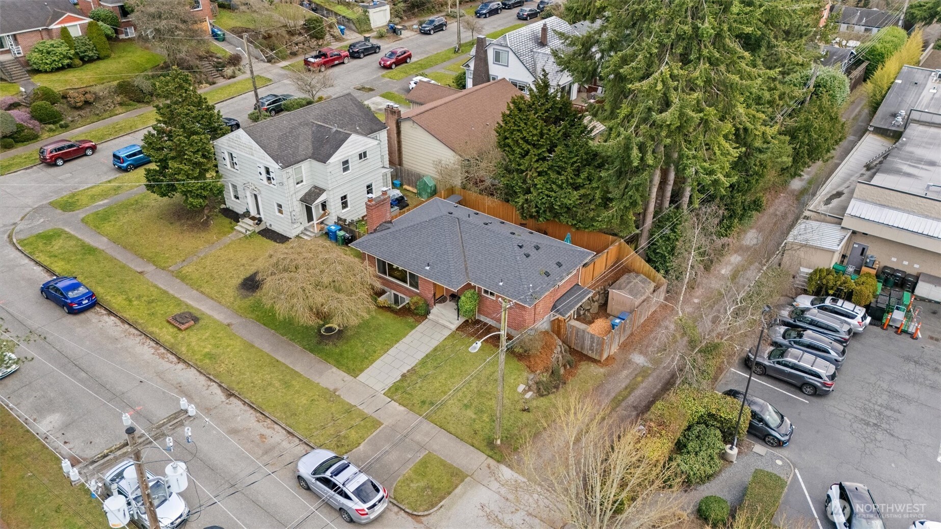 Drone photo at higher elevation. Here you can see the handy exterior shed for storage inside the fence to the side of the house.