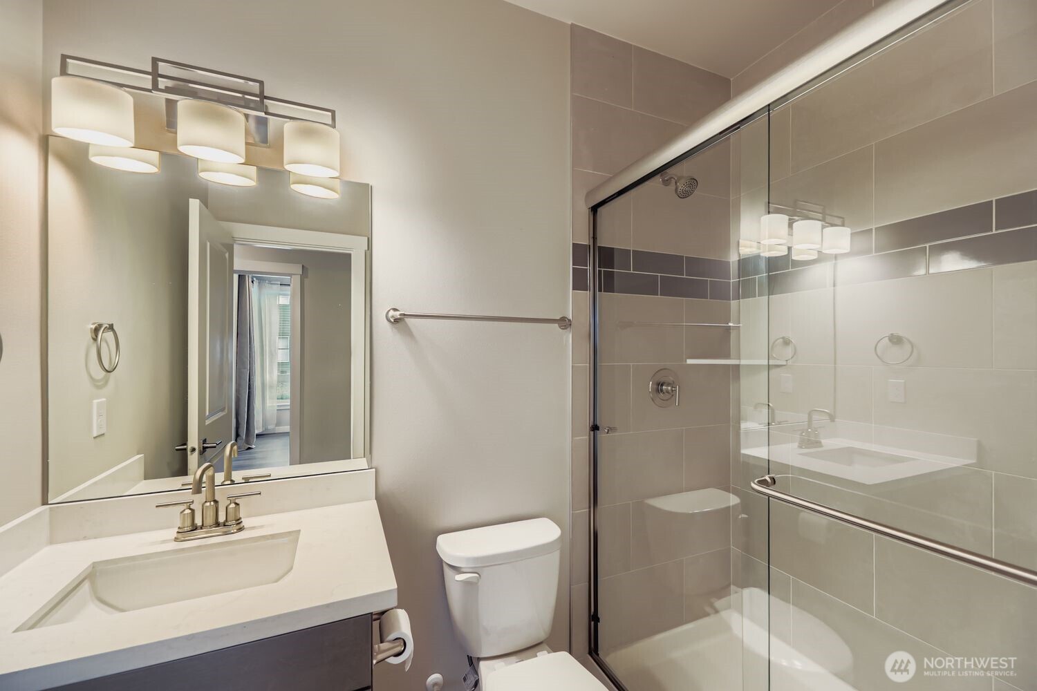 Main-level three-quarter bath with contemporary finishes.