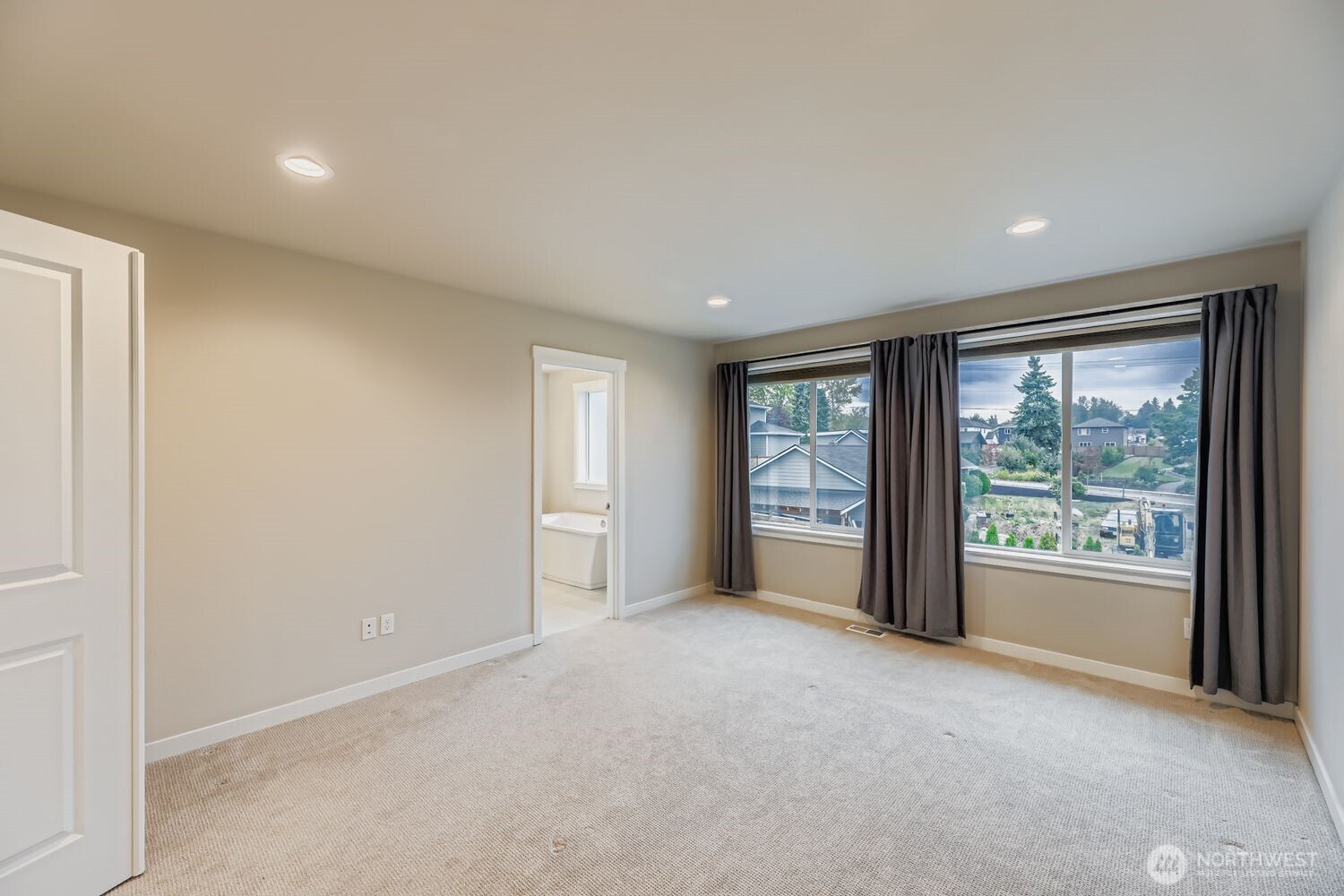Rec room windows capture Sound and Olympic Mountain vistas.