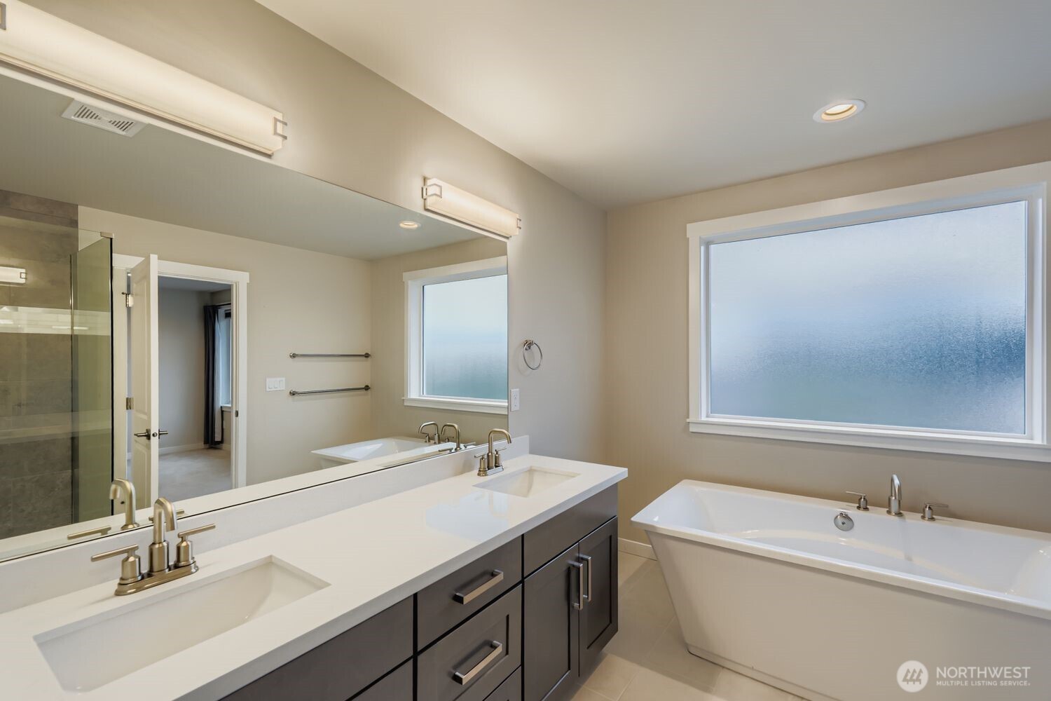 View from en suite bath to the vanity and water closet.