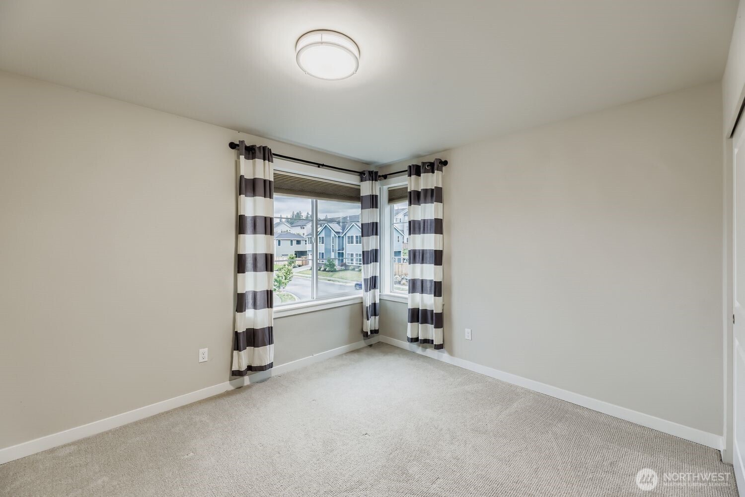 Upstairs bedroom offering flexible layout for study or sleep.