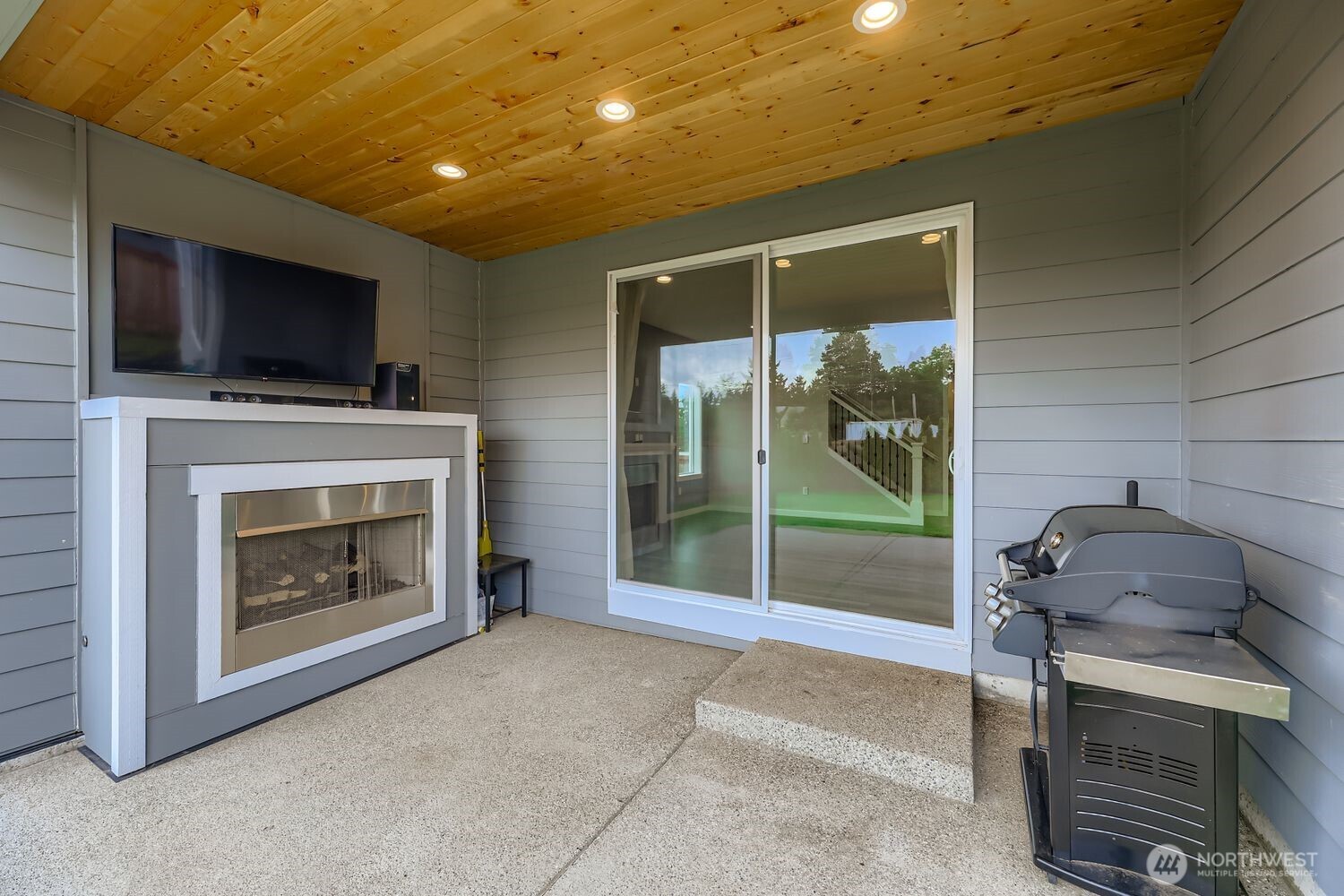 Laundry room with washer/dryer hookups and storage.