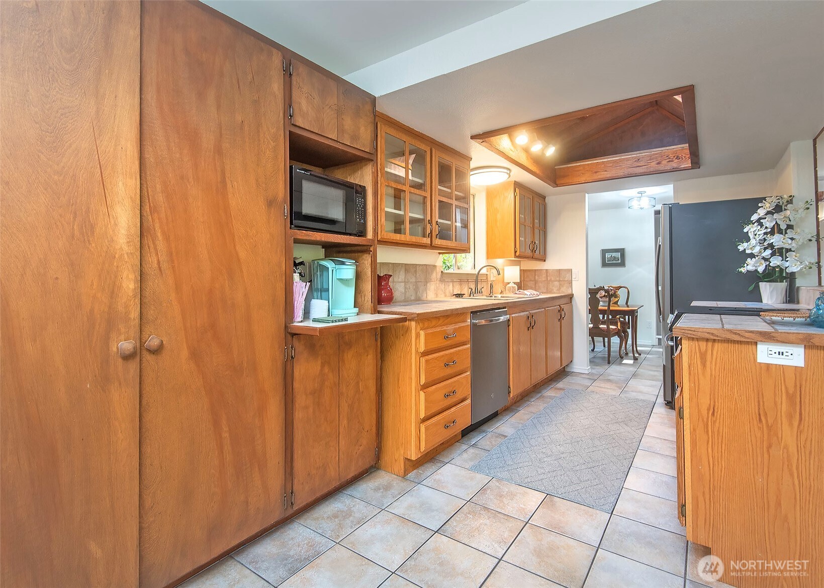 Kitchen has a large panty on the left.