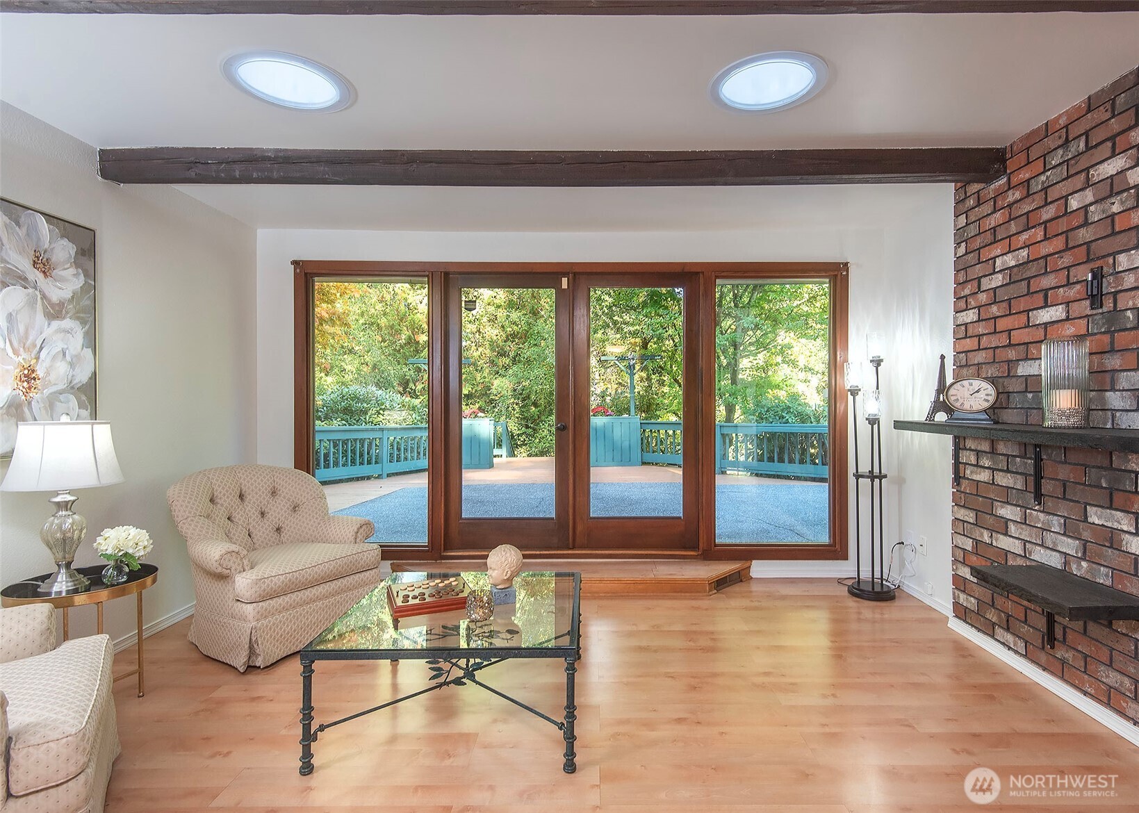 Living room looking to French doors and deck.