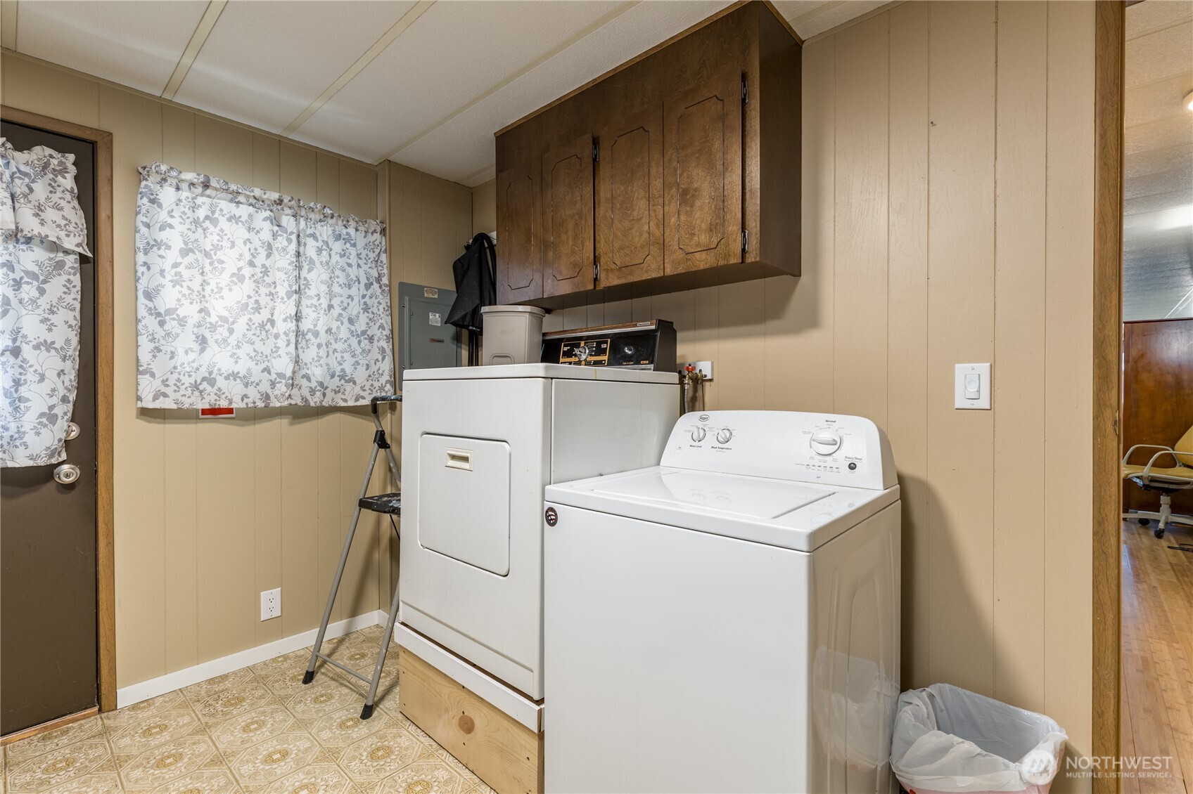 Laundry room with direct access to the carport. Washer & dryer (& pedestal) stay!