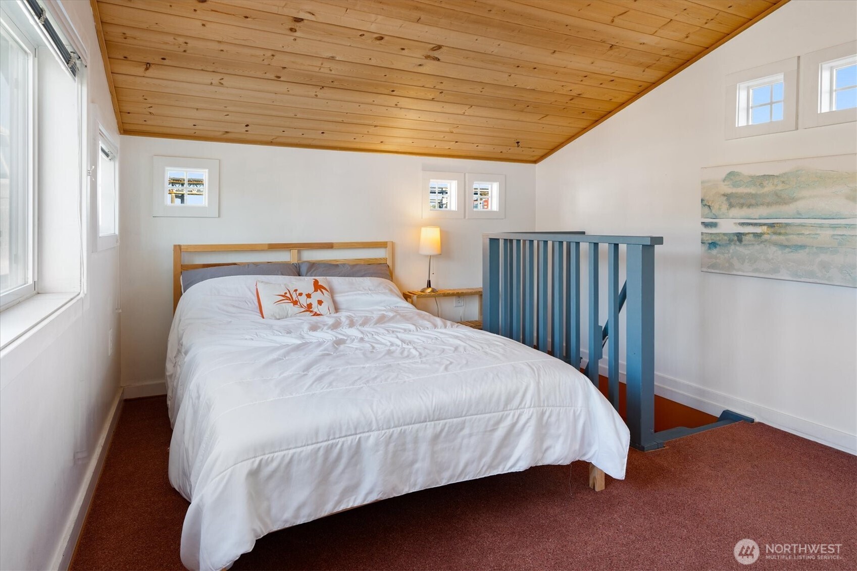 Up the stairs, find a sunny, welcoming bedroom.