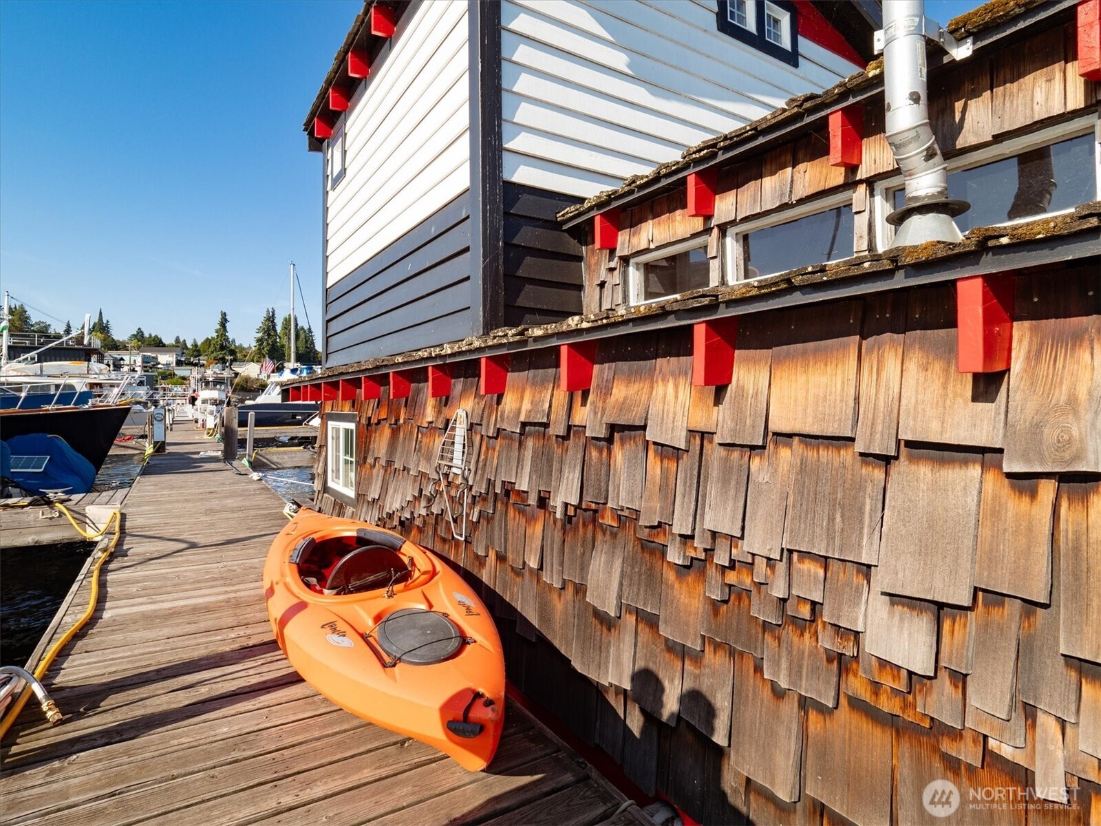 The houseboat occupies the last slot on the dock, making for convenient and view-filled living.