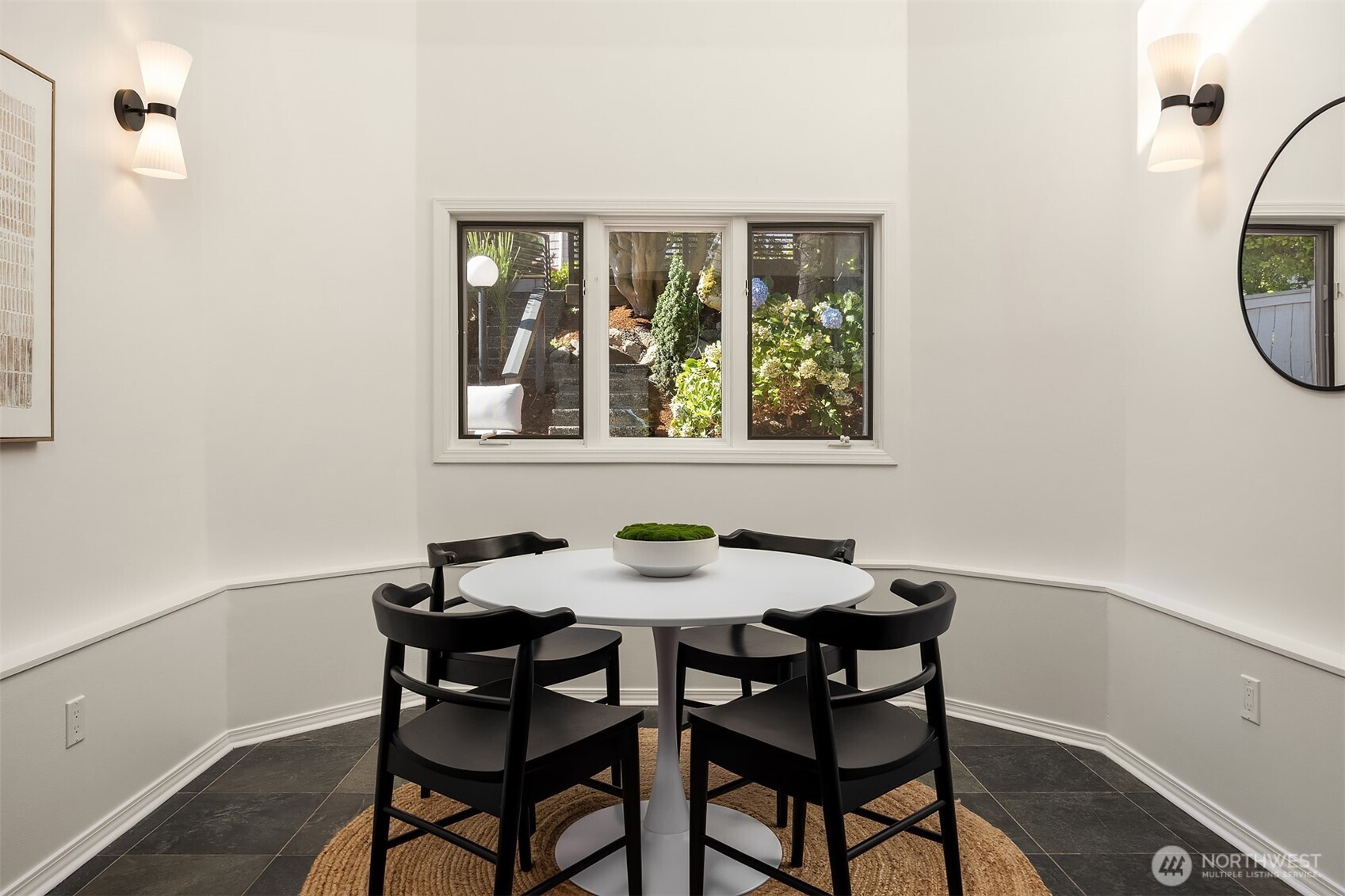 View of the lovely backyard and skylights for this breakfast nook
