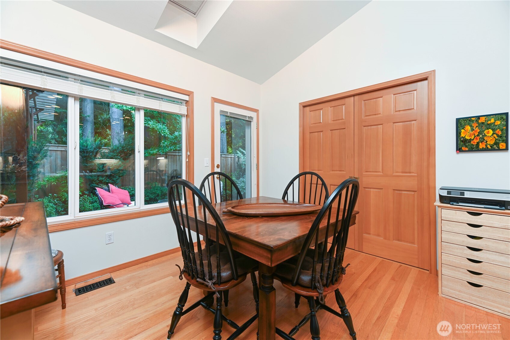 Warm wood pocket doors separate the dining area from the living room. Great for living and entertaining.