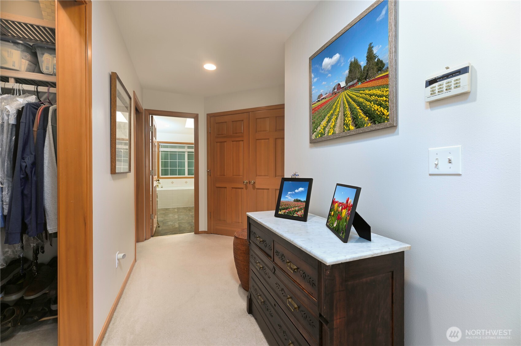 French doors to the Primary Suite with two full size walk-in closets.