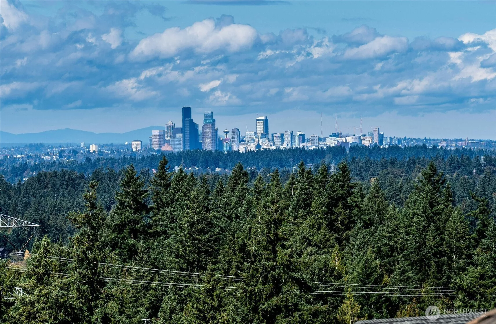 Front & center VIEWS of all of downtown Seattle and the Olympic Mountain range! Far-reaching views with colorful territorial views too.