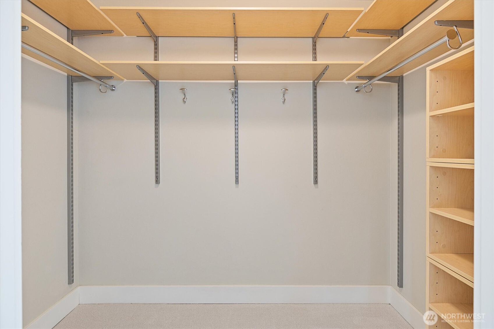 The primary suite is complete with dual walk-in closets—designed so both partners have their own spacious storage.