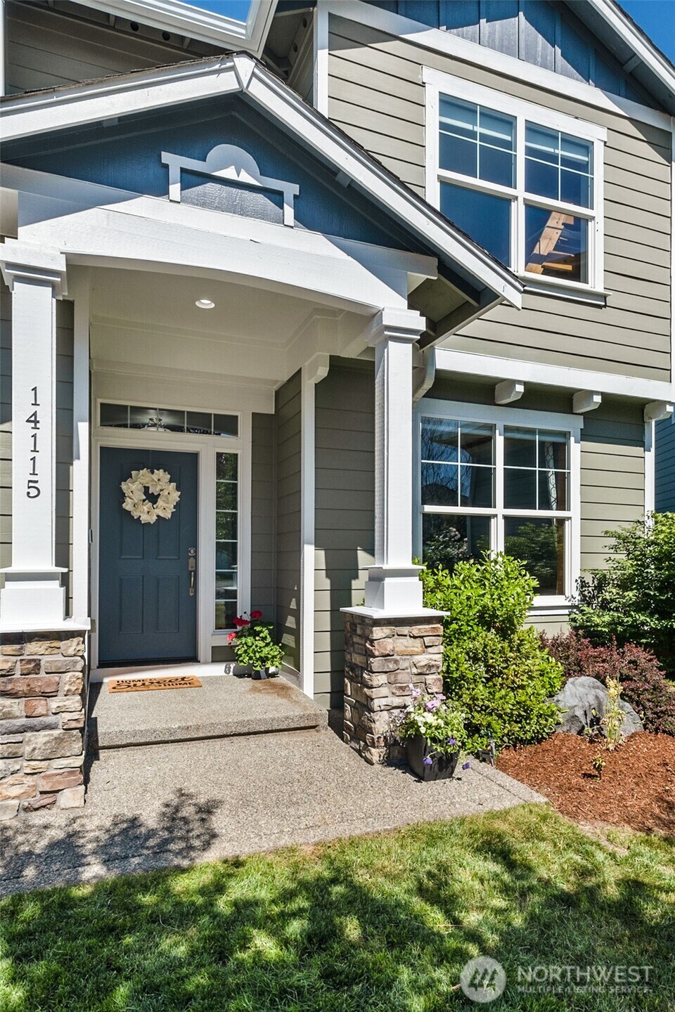 The charming covered porch welcomes you Home each day.