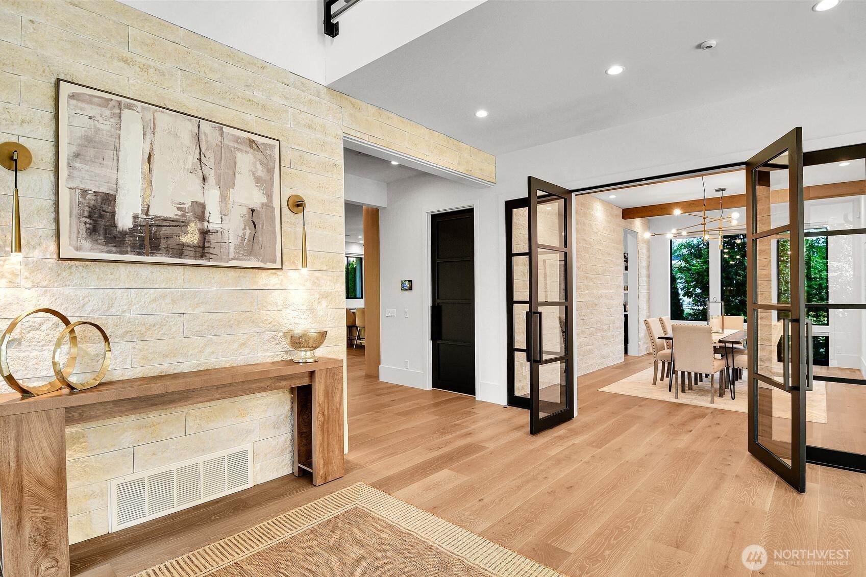 A stacked stone wall provides a beautiful accent in the foyer