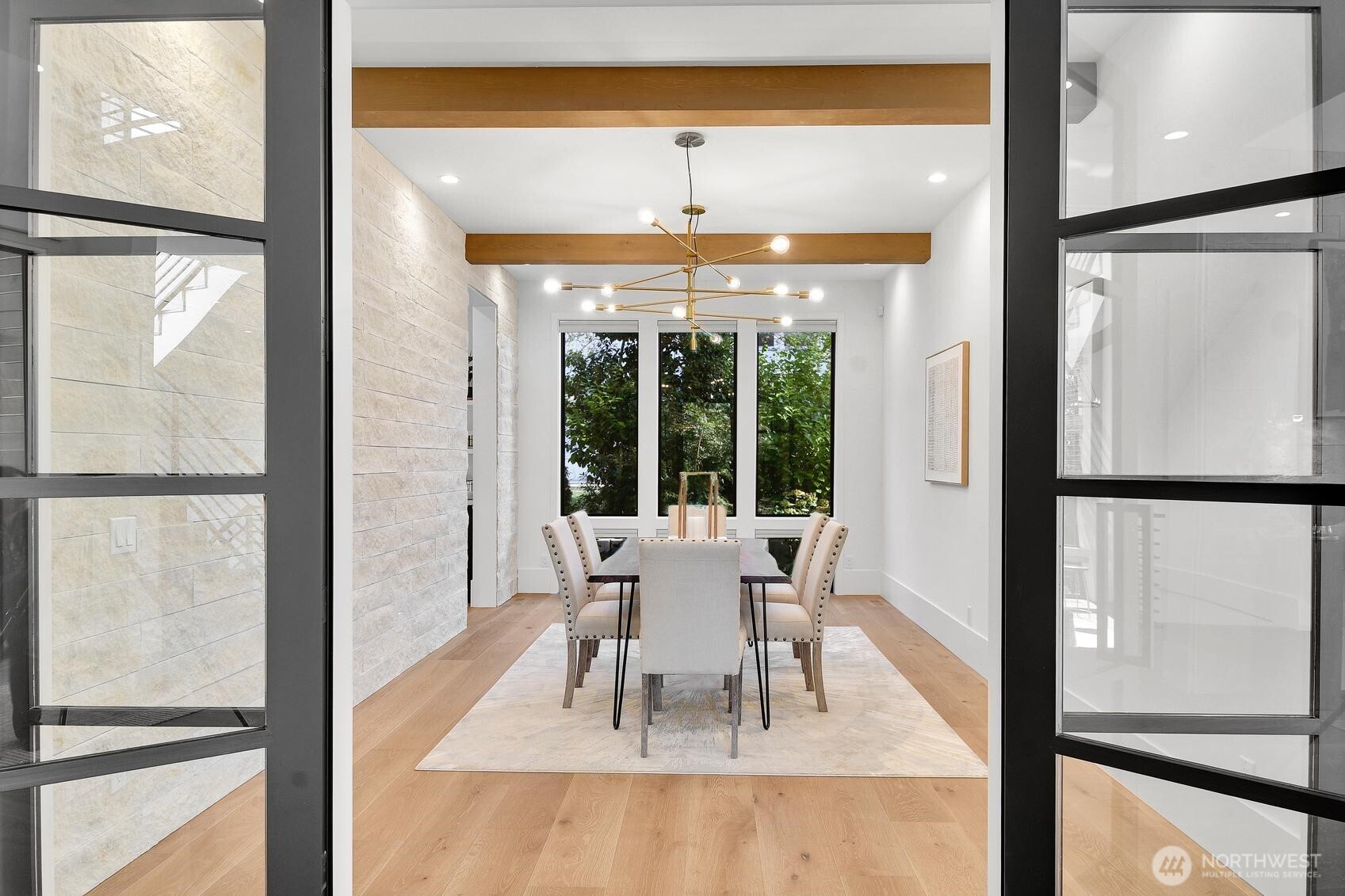 French doors open to the formal dining room