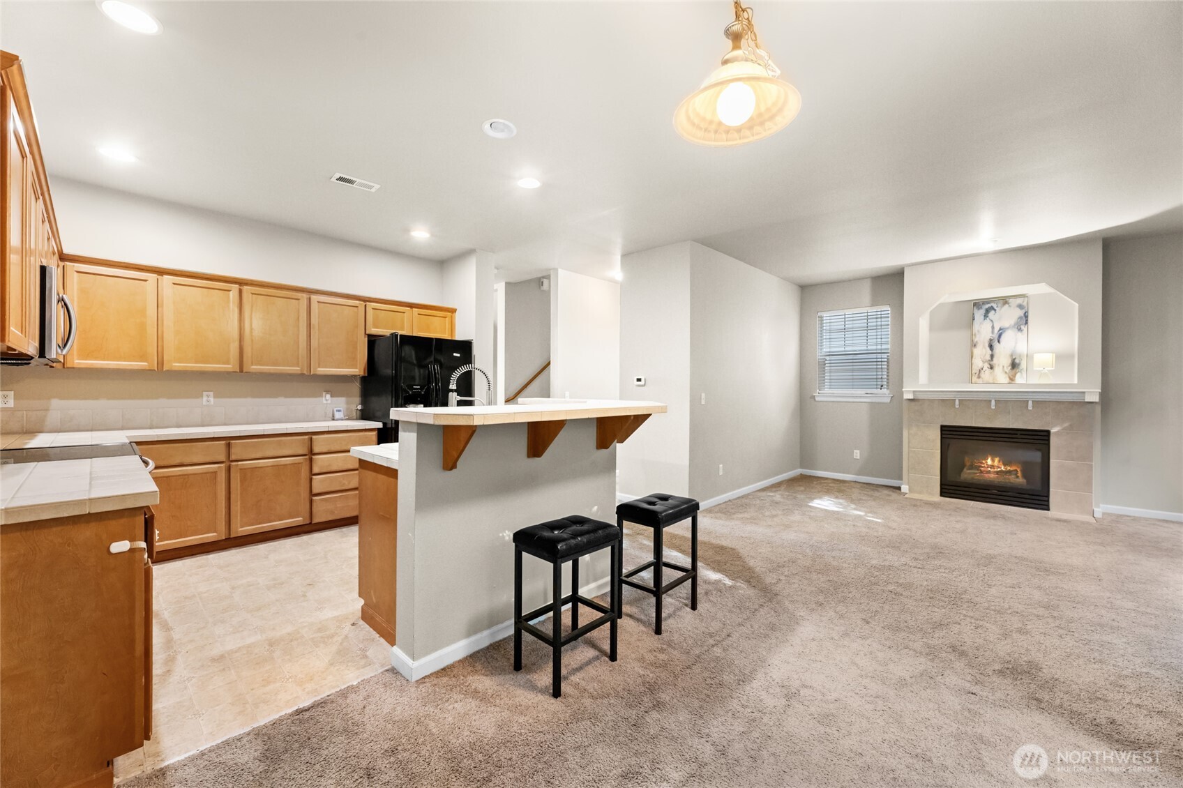 Gas fireplace in the family room with views to the backyard