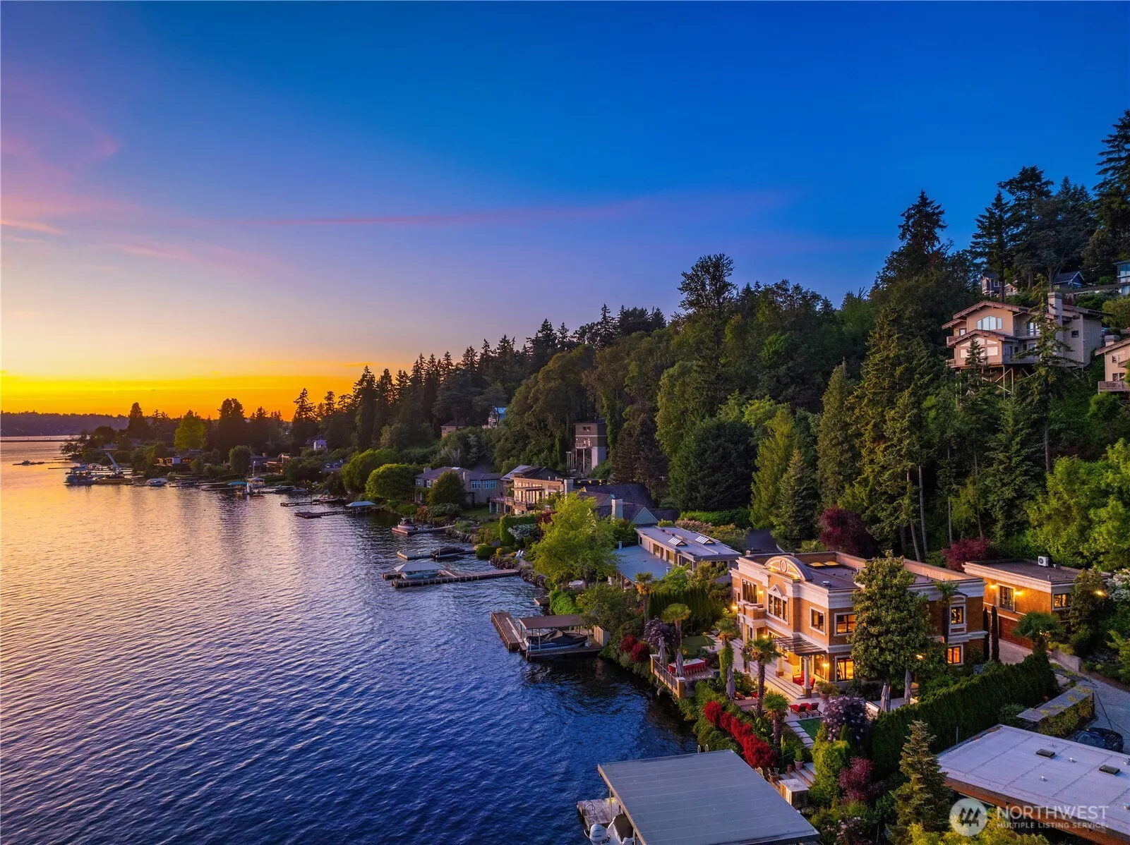 Sited on the shores of Lake Washington on Mercer Island's west side Gold Coast, this custom sun kissed custom villa lives and entertains like a dream.