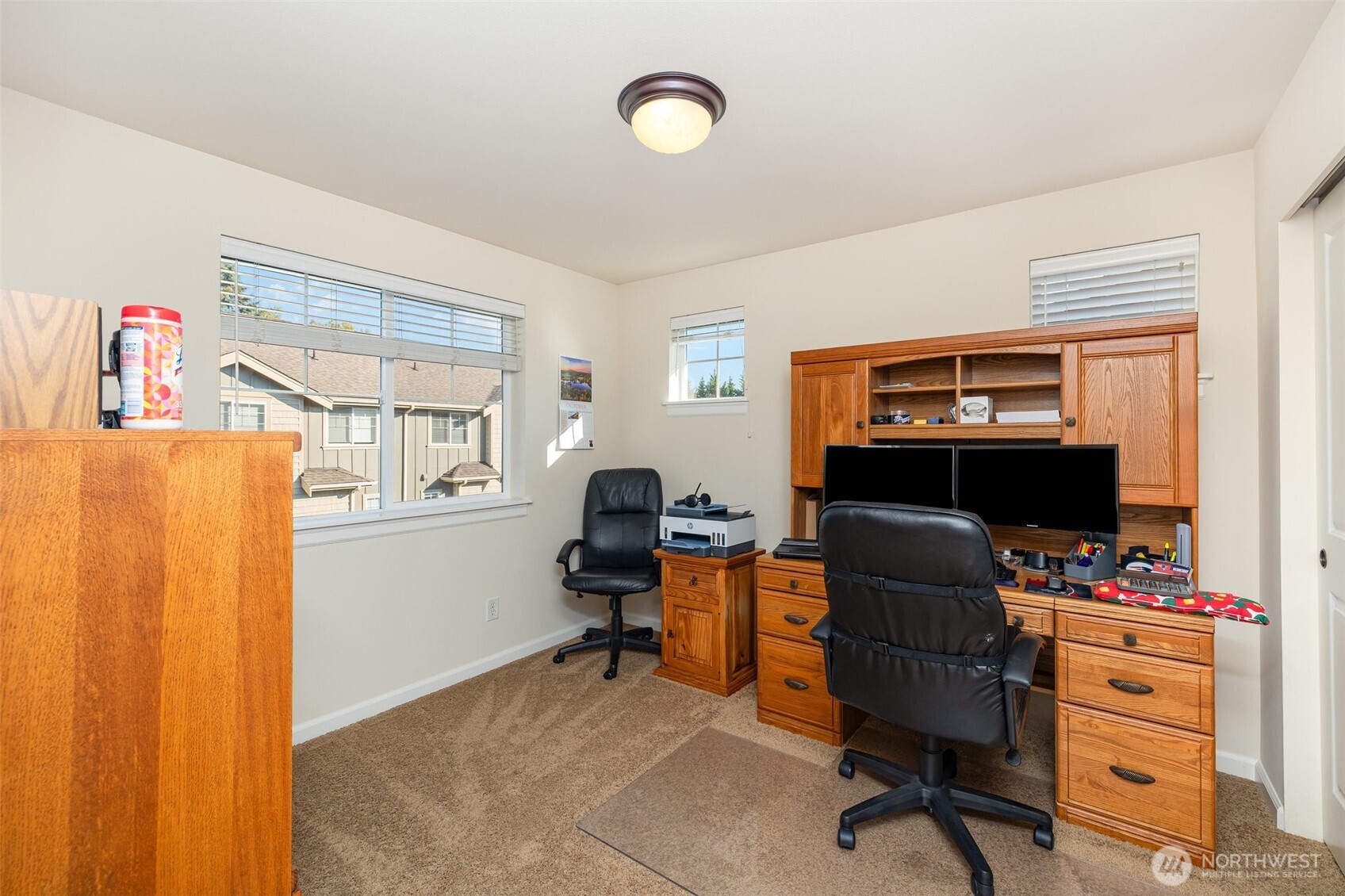 Upstairs guest bedroom with large sliding door closet.