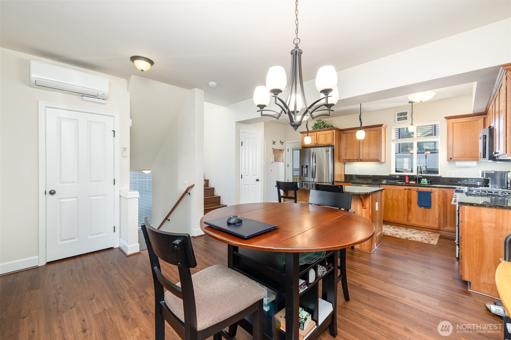 Main level boasts an open floor plan with LVP flooring, where living, dining & kitchen flow seamlessly together.