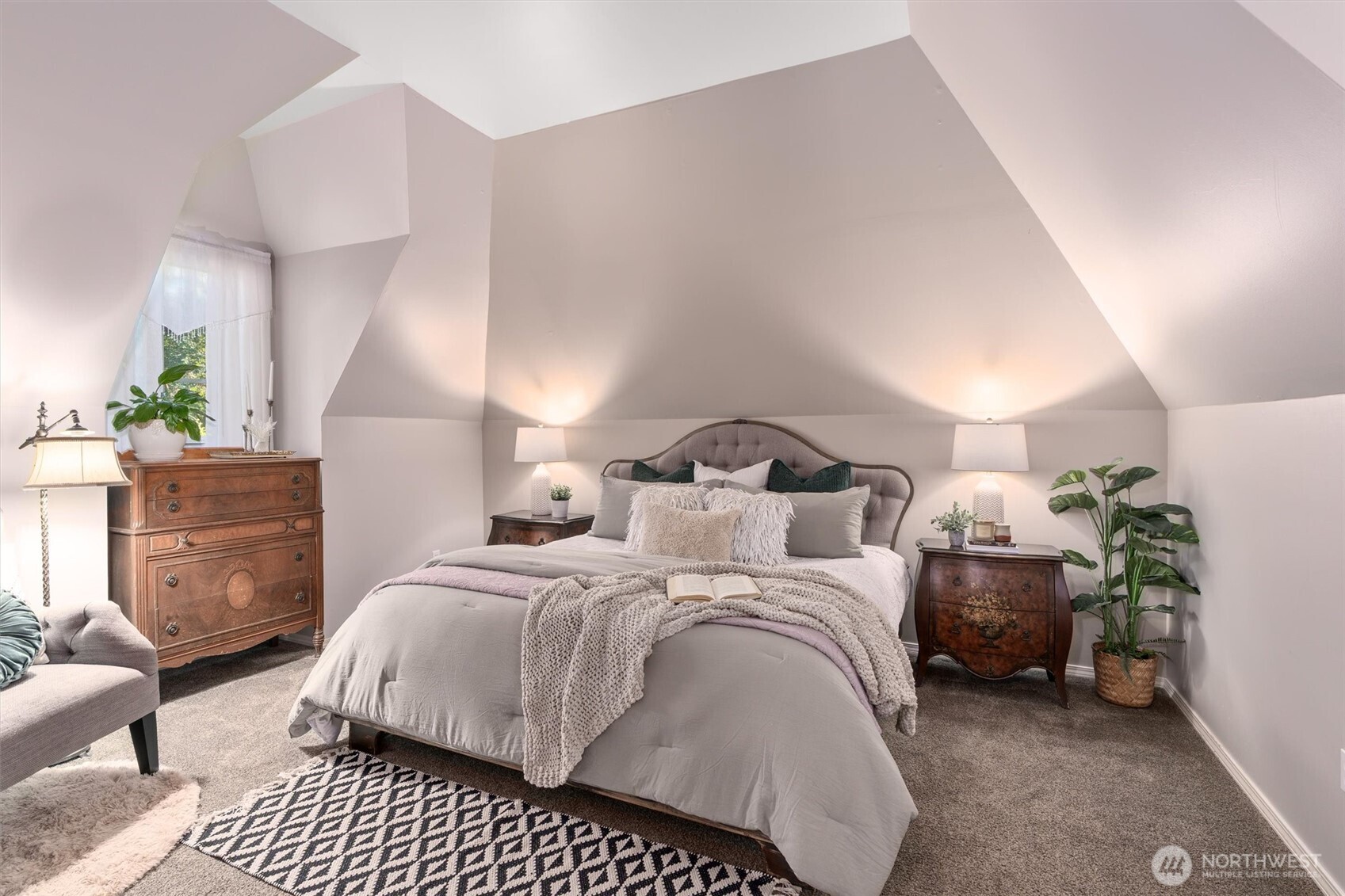 Grand spiral staircase leads to upstairs bedrooms and laundry room.