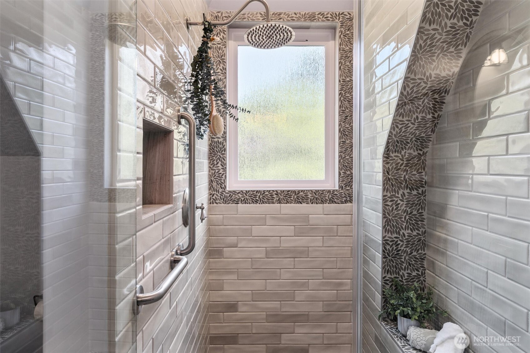 Luxurious walk in shower with heated towel rack.