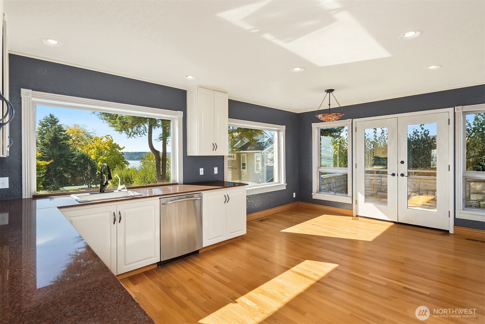 The oversized kitchen offers casual dining and opens to the patio for al fresco dining