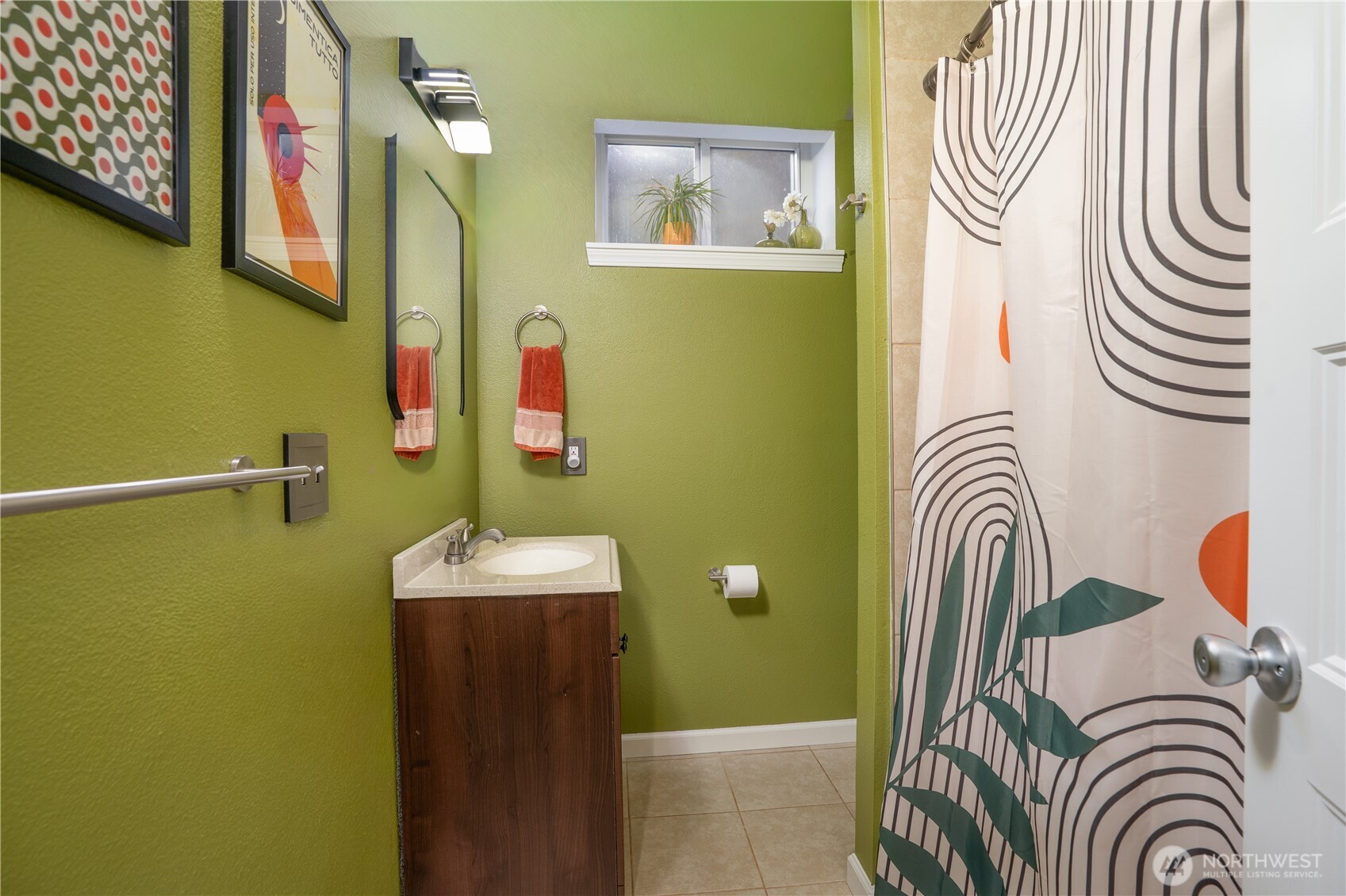 Lower Level Full Bath…has both a fresh air window & a ceiling light fan…