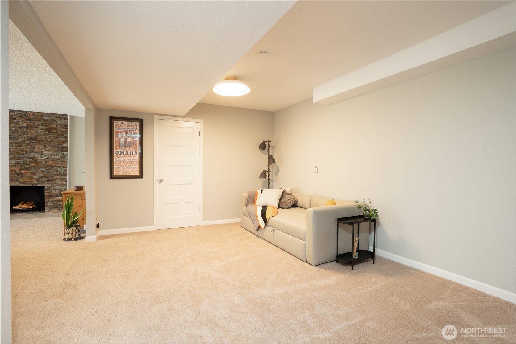 Stairs lead to spacious double room for recreation, media, pool table, foosball, library seating area with furnace room & extra storage thru the far door…