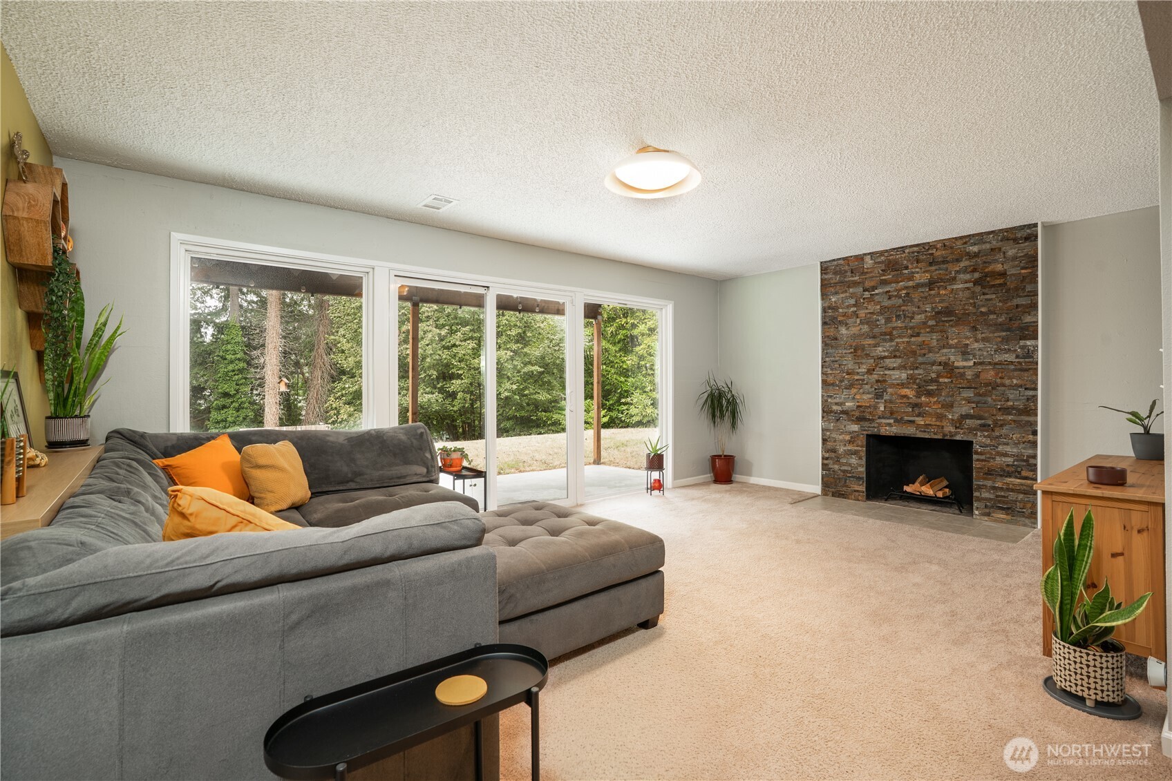 Lower level recreation room expands to include 2nd wood burning fireplace, to outside covered patio & adjacent deck with terraced yard beyond…